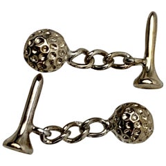 A Pair of Silvered Cufflinks with Golf Ball and Tee, USA, circa 1970's