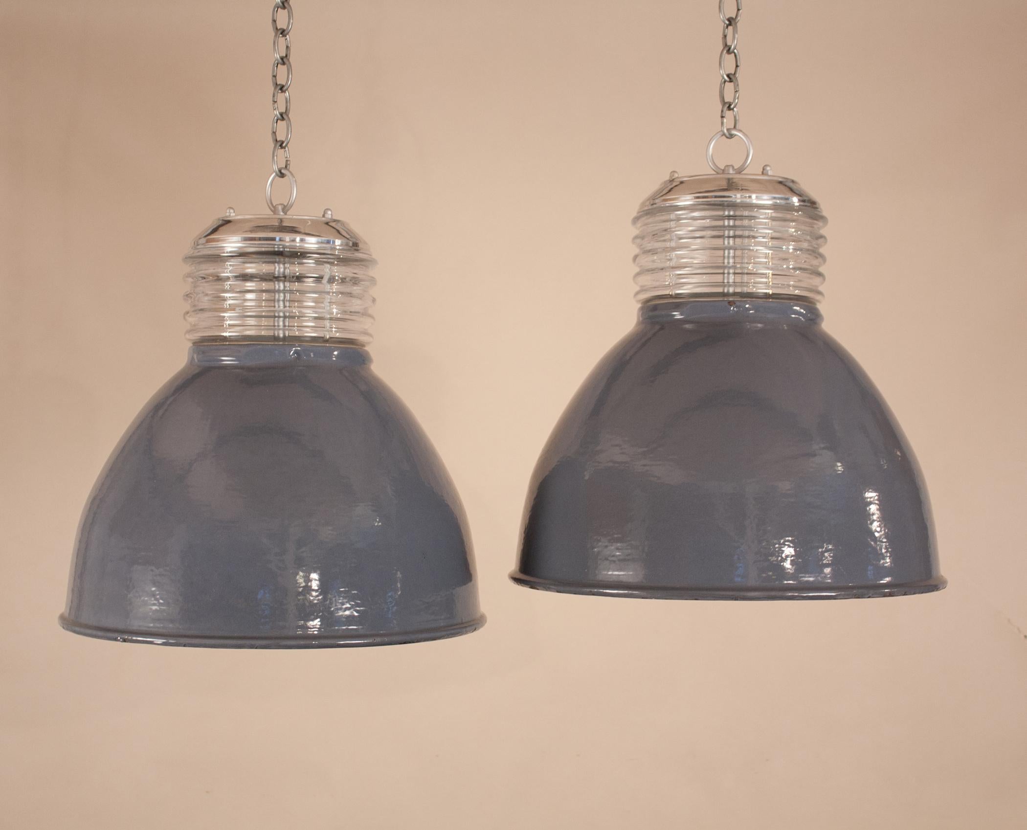Custom-designed from vintage components, these larger-sized Industrial pendants are one-of-a-kind. The gray enamel shades with white interiors are from the 1960s. With their age comes expected minor blemishes (as shown in photos) that add to the