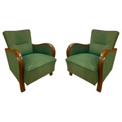Paire de fauteuils verts vintage