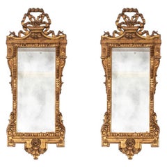 Coppia di specchi da parete vintage in legno intagliato a mano e dorato italiano