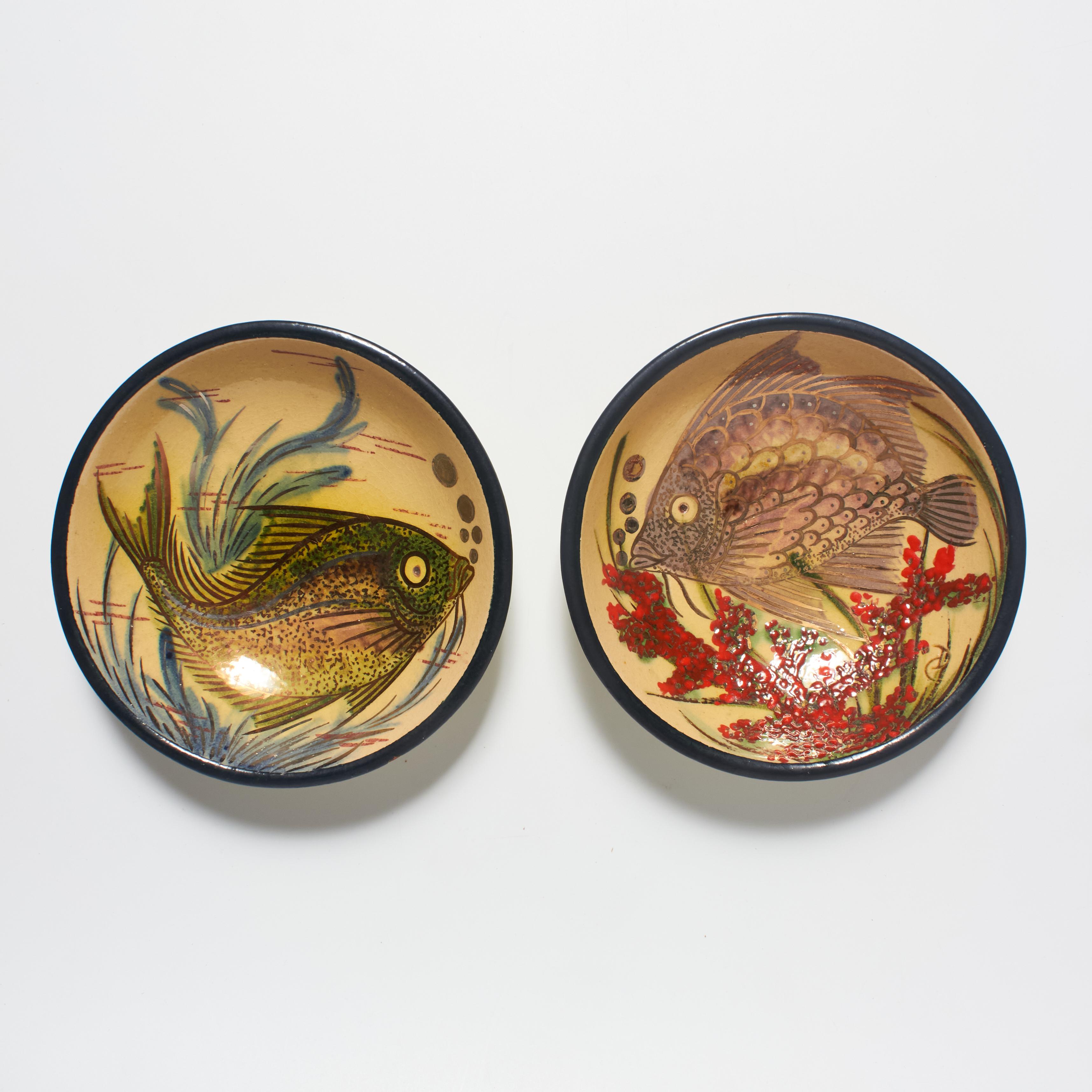Immerse your space in the enchanting world of Catalan artist Diaz Costa with our pair of vintage hand-painted ceramic plates, each featuring a captivating fish motif. Crafted with artistic finesse, these plates showcase Diaz Costa's unique ability