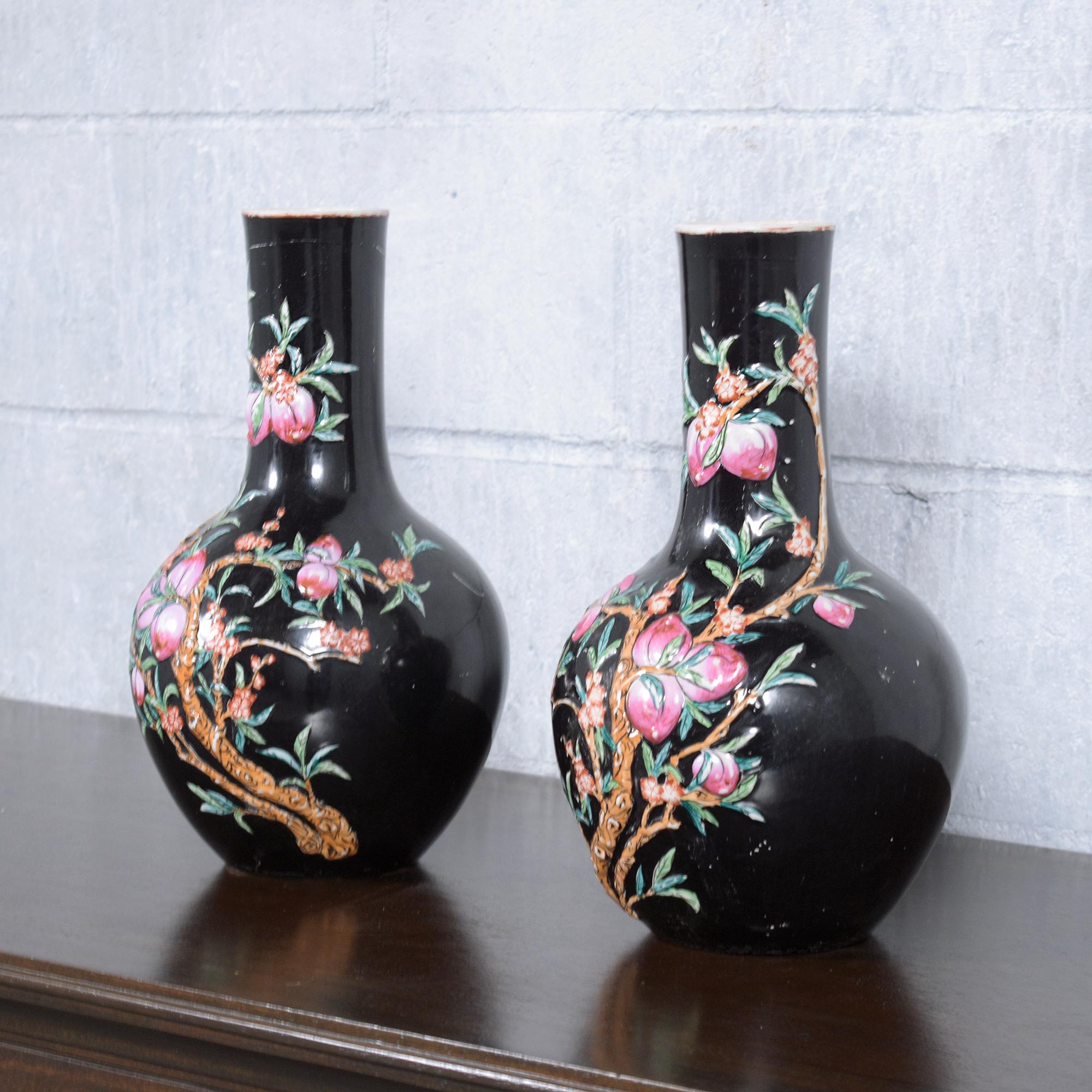 Discover the charm and beauty of traditional Chinese artistry with our pair of vintage Chinese porcelain vases. These exquisite pieces are in good condition, showcasing the finesse and detail that is characteristic of classic Chinese porcelain. Each