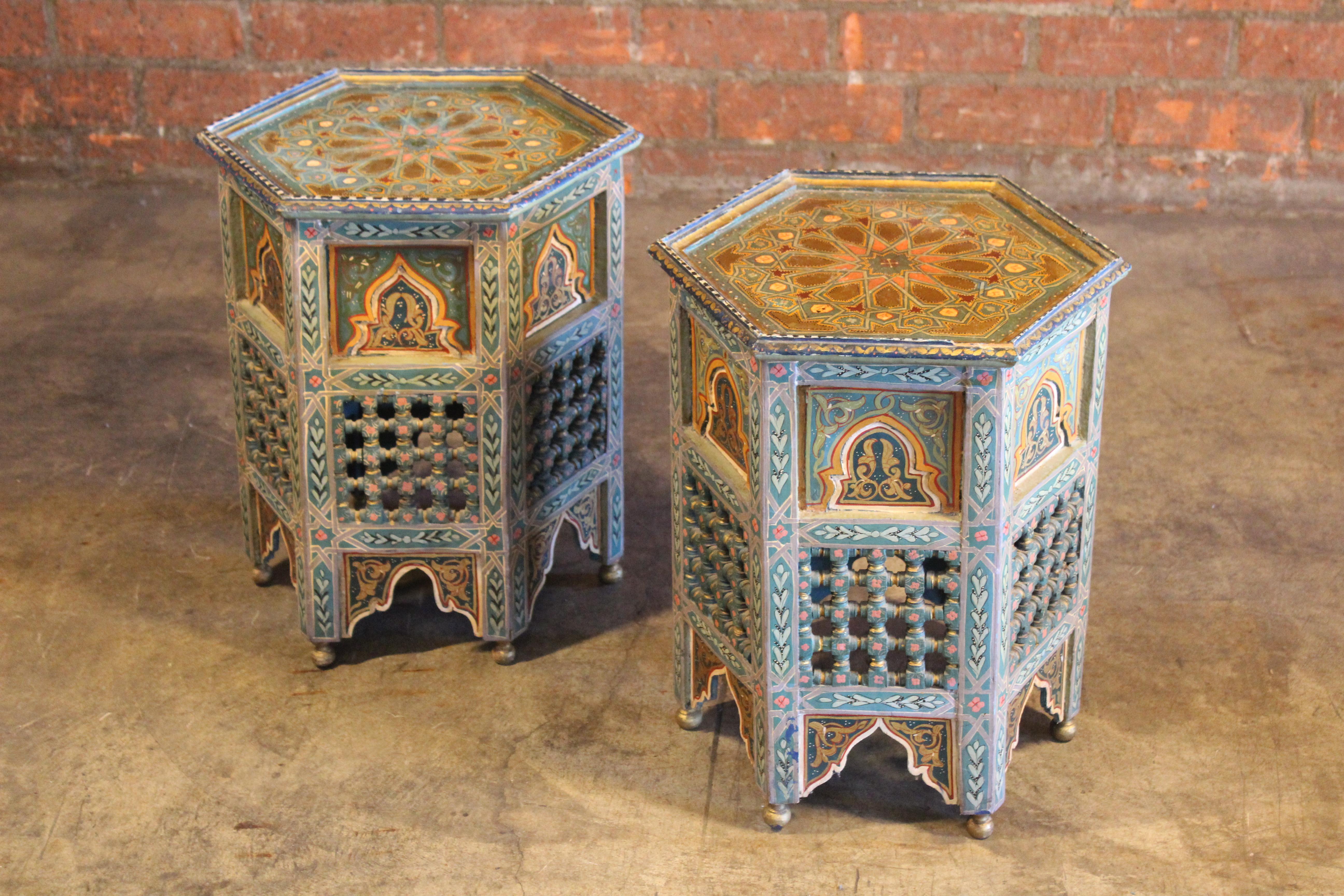 A pair of vintage, hand-painted Moroccan end or side tables. In good condition. Sold as a pair.