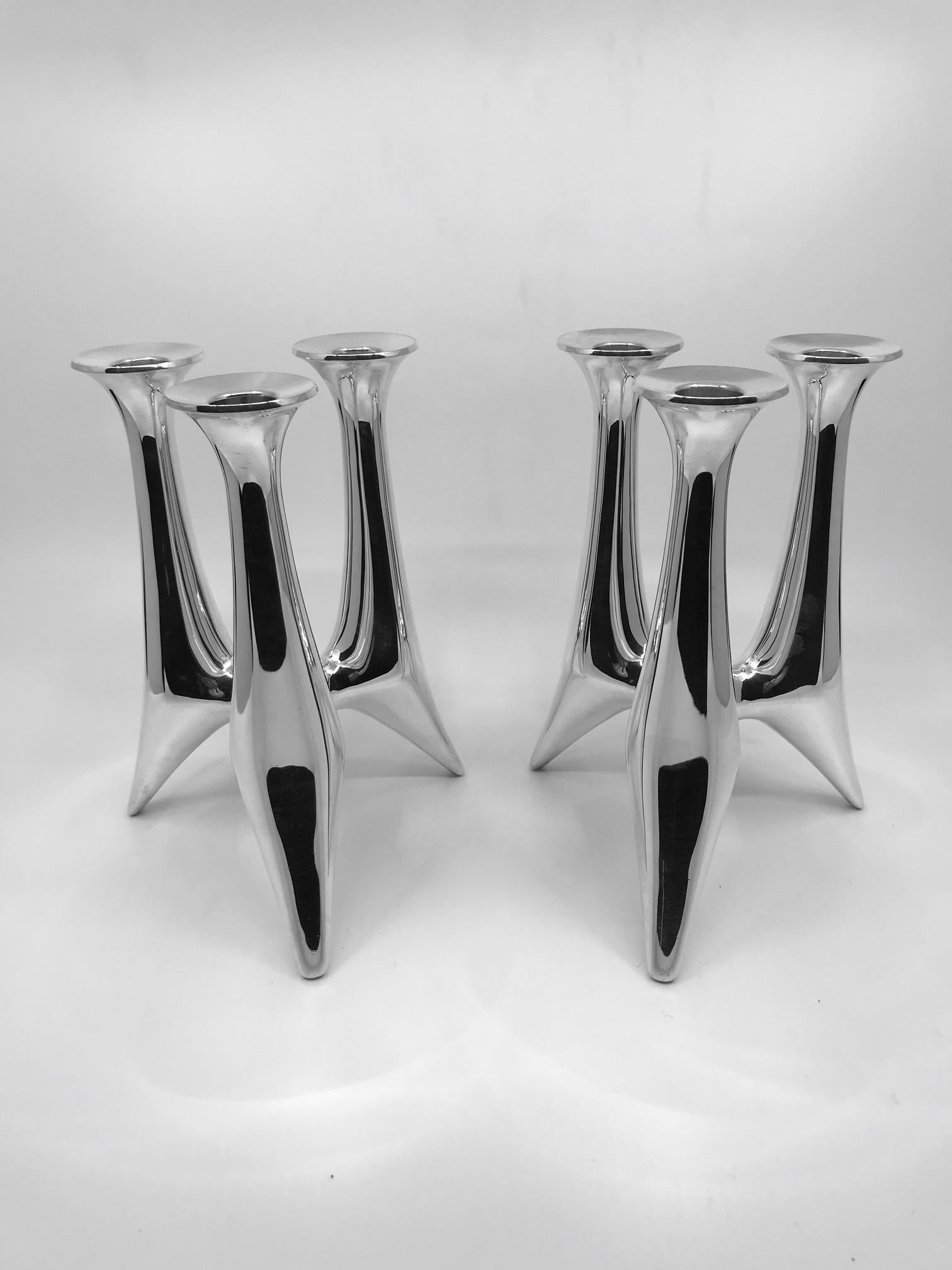 This is a pair of midcentury sterling silver Hans Hansen three-light candelabra, design #494 by Bent Gabrielsen. These candelabra are completely handmade and hollow.

Measures: 7 3/8