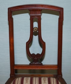 PAIR OF VINTAGE HARDWOOD DINING CHAIRS WITH CARVED DETAiL AND UPHOLSTERED SEATS