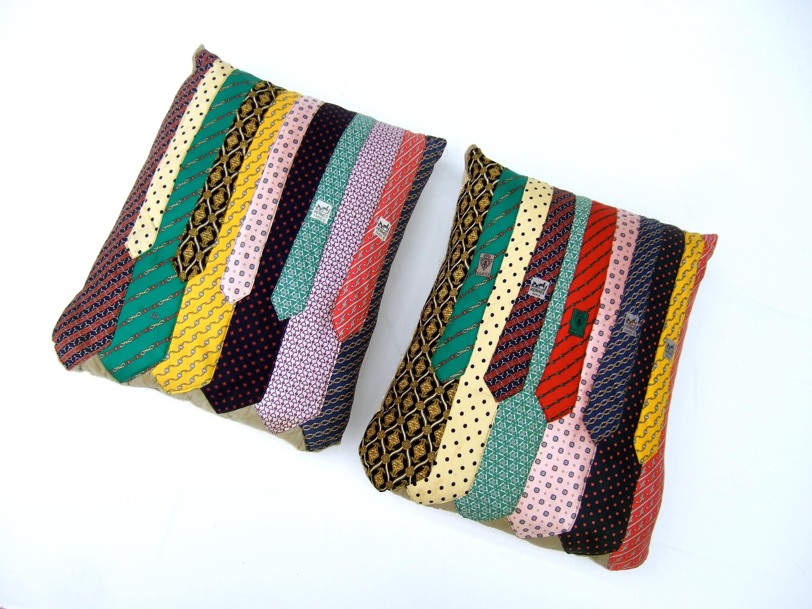 Unique pair of handmade Hermes & Gucci vintage up-cycled silk necktie pillows c 1980s 
The pair of decorative pillows are designed primarily with a collection 
of vintage Hermes & Gucci silk neckties. Some of neckties are unbranded  

The pair of