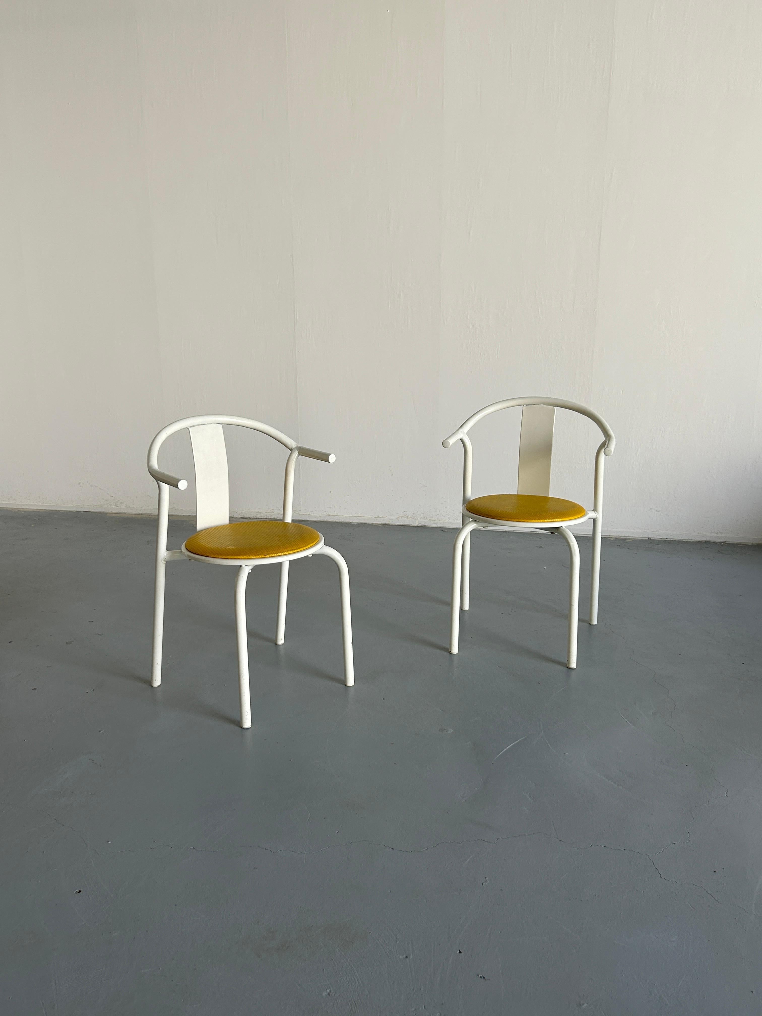 Set of two vintage 1980s Ikea MAXMO white and yellow metal dining chairs. 
Rare and collectible.

Overall in good vintage condition with expected signs of age. Structurally perfect.
One noticeable hole on the seat - as depicted in the photos. Hole