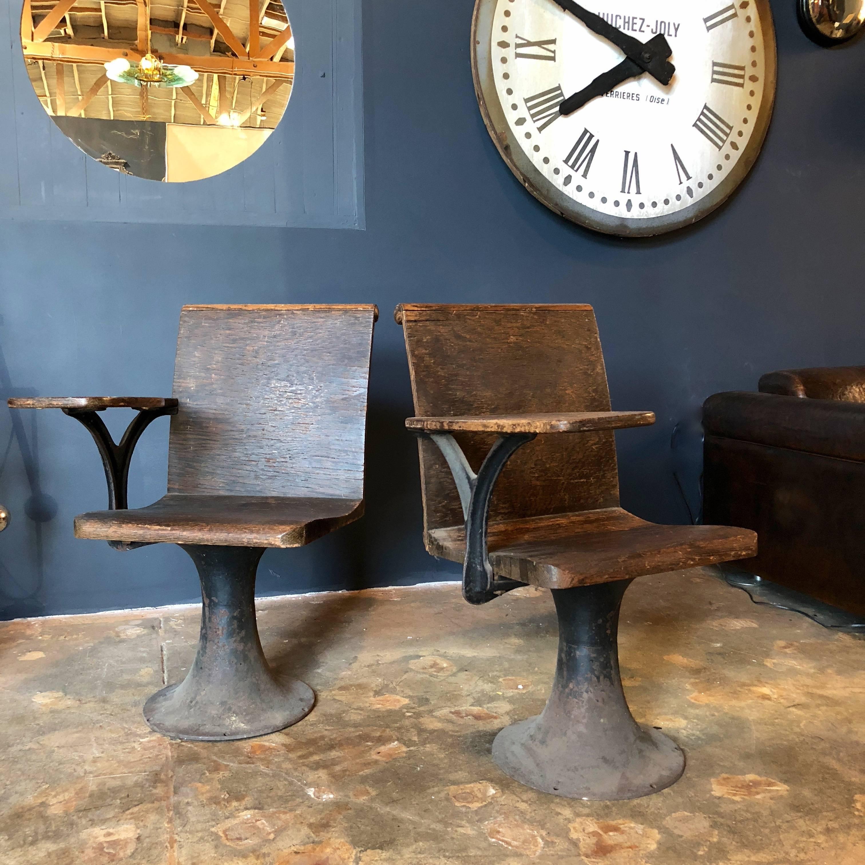 1920s American pair of industrial cast solid wood school desks with iron base.