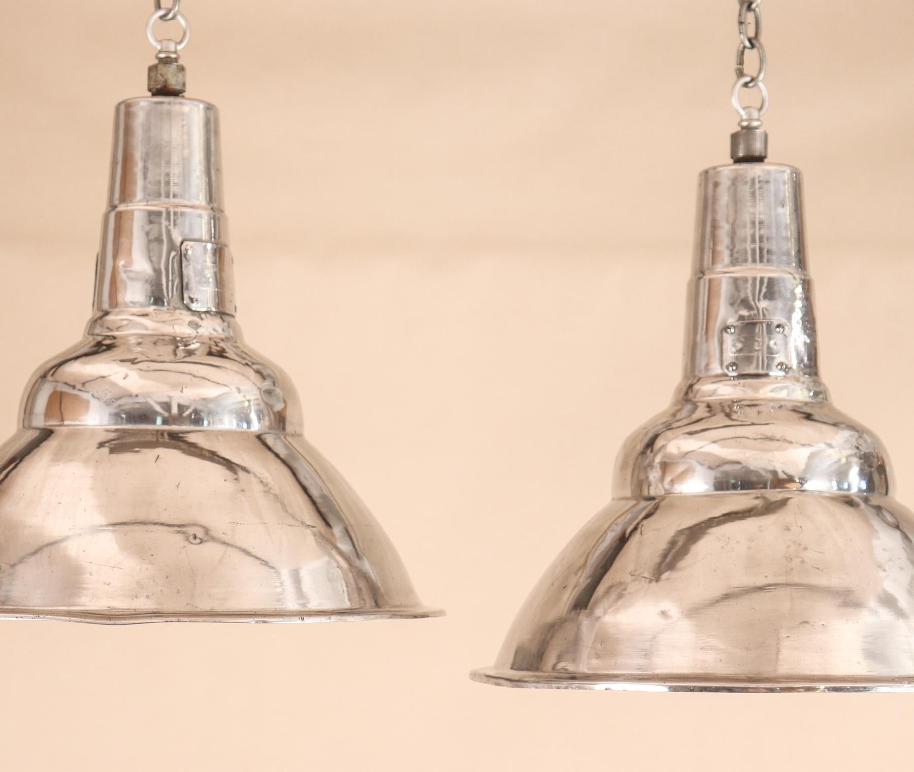 Pair of Vintage Industrial Aluminum Floodlight Pendants In Good Condition In Heath, MA