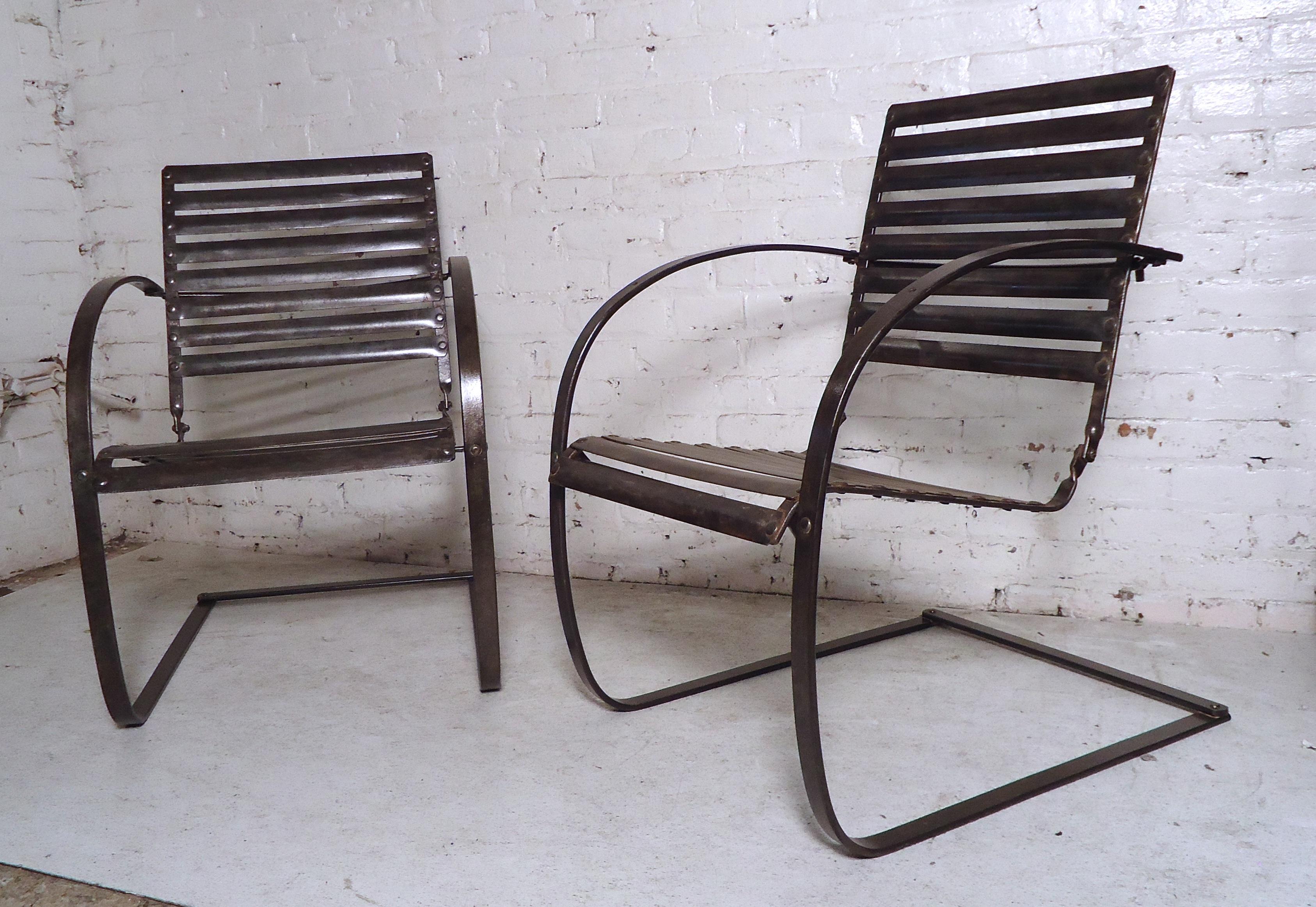 This pair of Industrial spring chairs feature a detachable seat, slat back and metal frame.
(Please confirm item location - NY or NJ - with dealer).