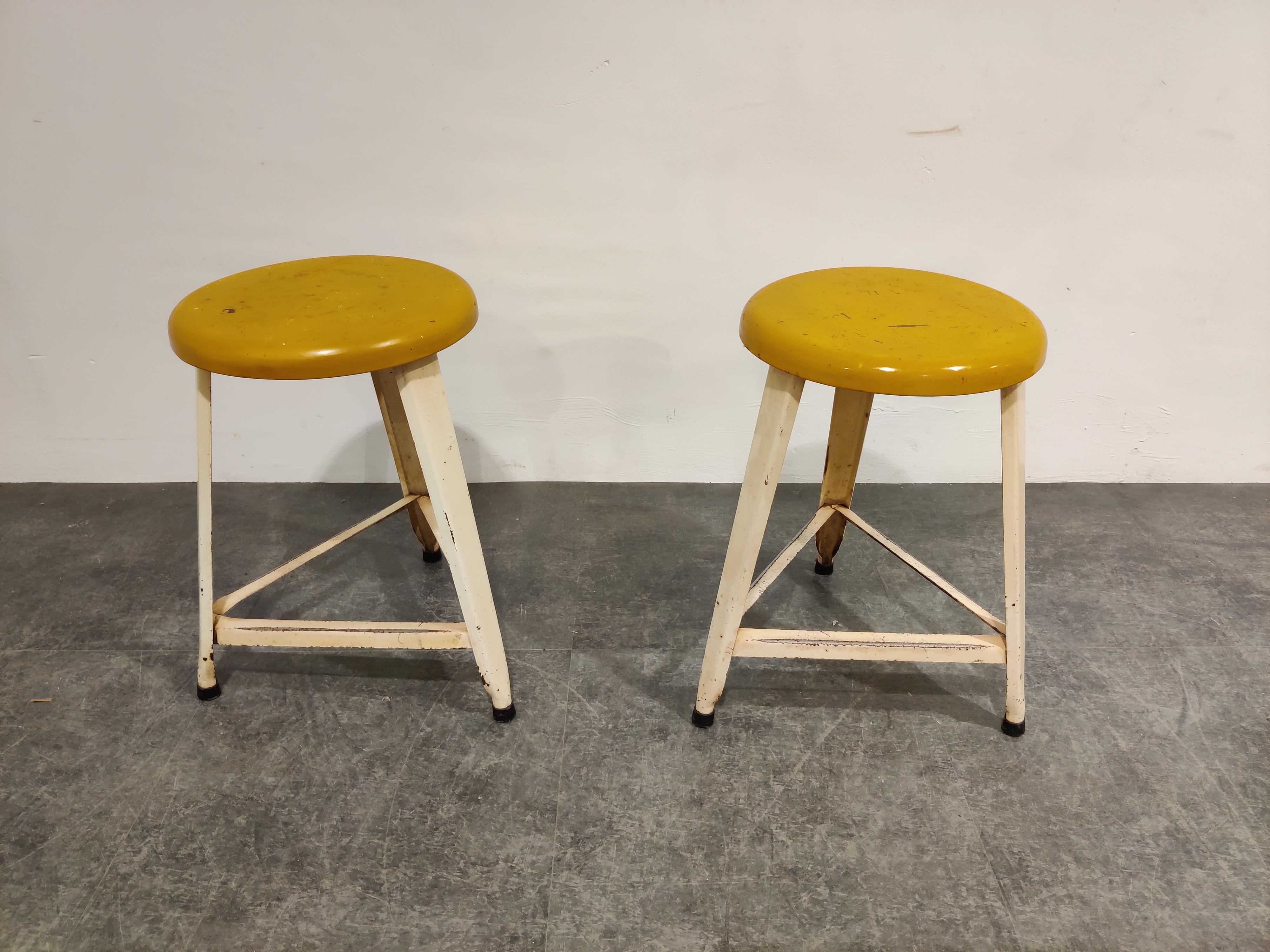 A pair of simple, honest industrial stools with a tripod aluminum base and yellow seat.

Good original condition with a nice original look.

1960s - Netherlands

Dimensions:
Height: 50cm/19.68