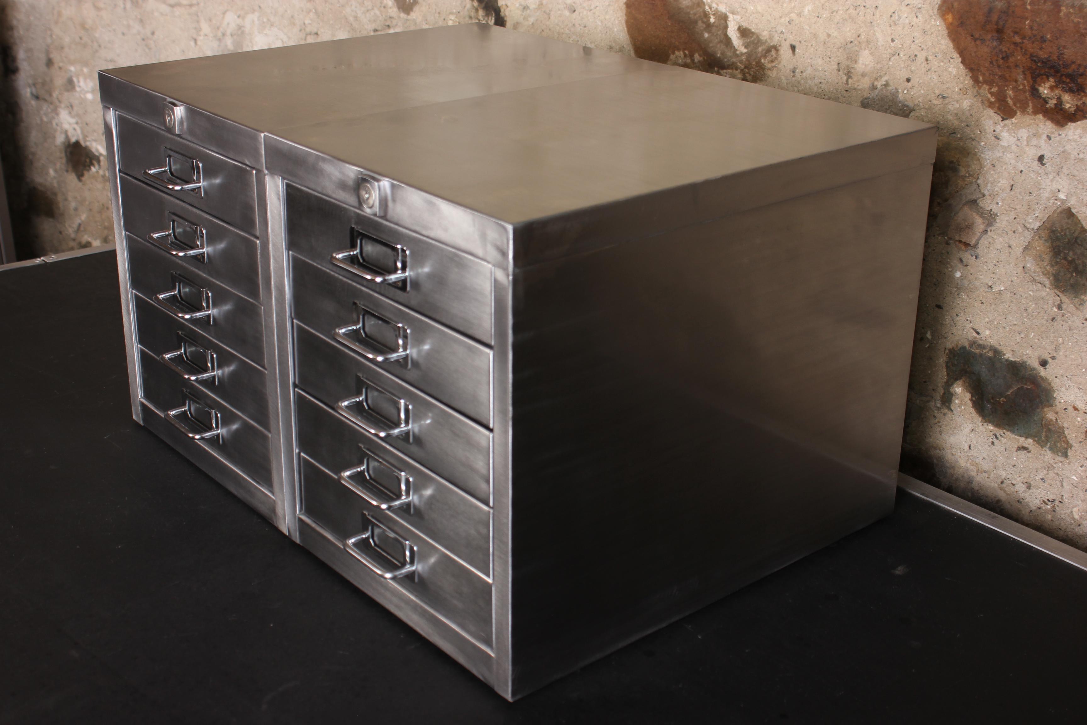 A stunning pair of vintage 1980s industrial stripped metal 5-drawer filing cabinets complete with keys. These impressive desk top industrial design pieces have been stripped back to bare metal and were manufactured in the United Kingdom during the