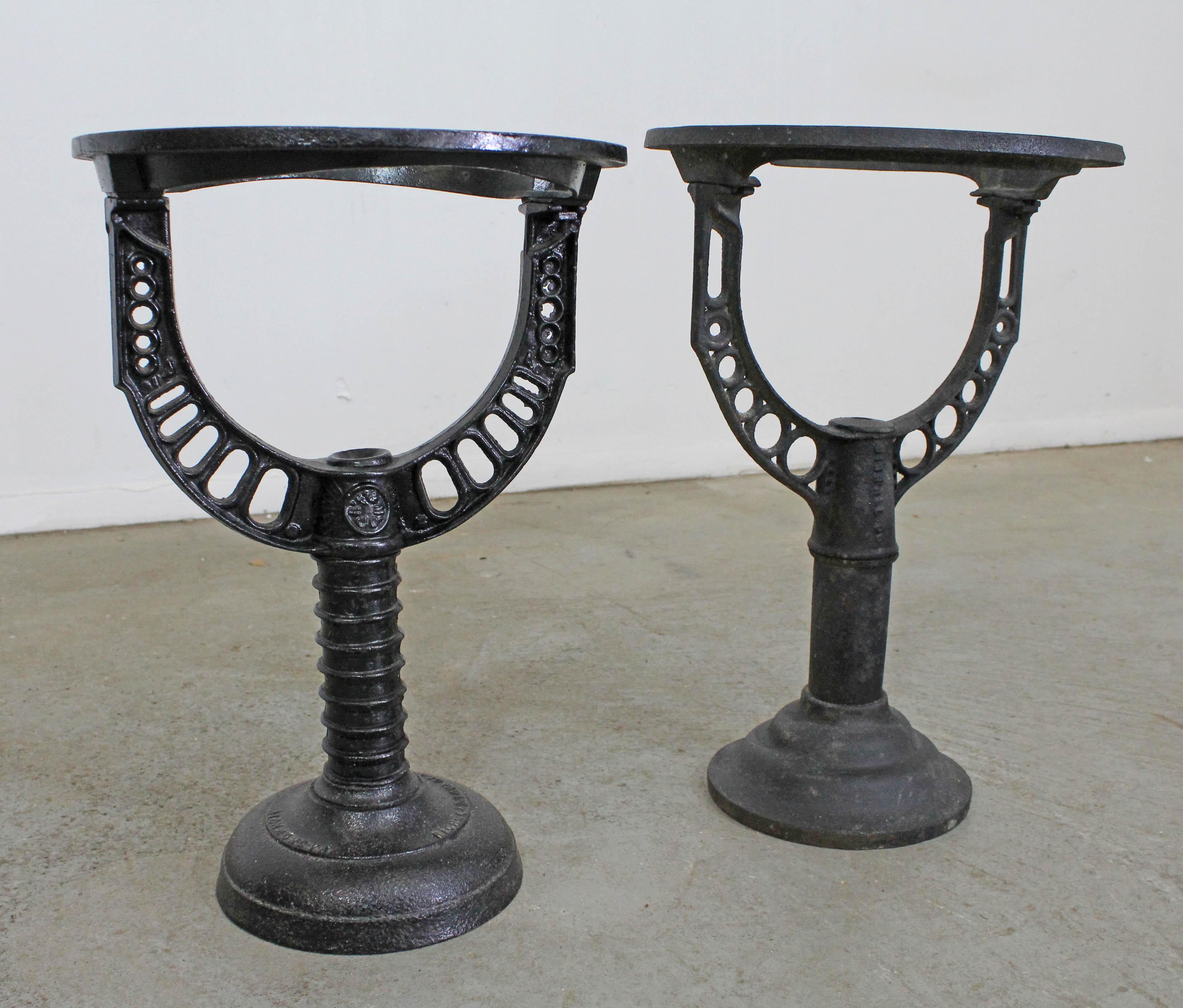 Offered is a pair of wrought iron tables made from salvaged architectural Industrial parts with added glass tops. These are super unique, custom made pieces converted into end tables. One table is half an inch taller. They are in good condition