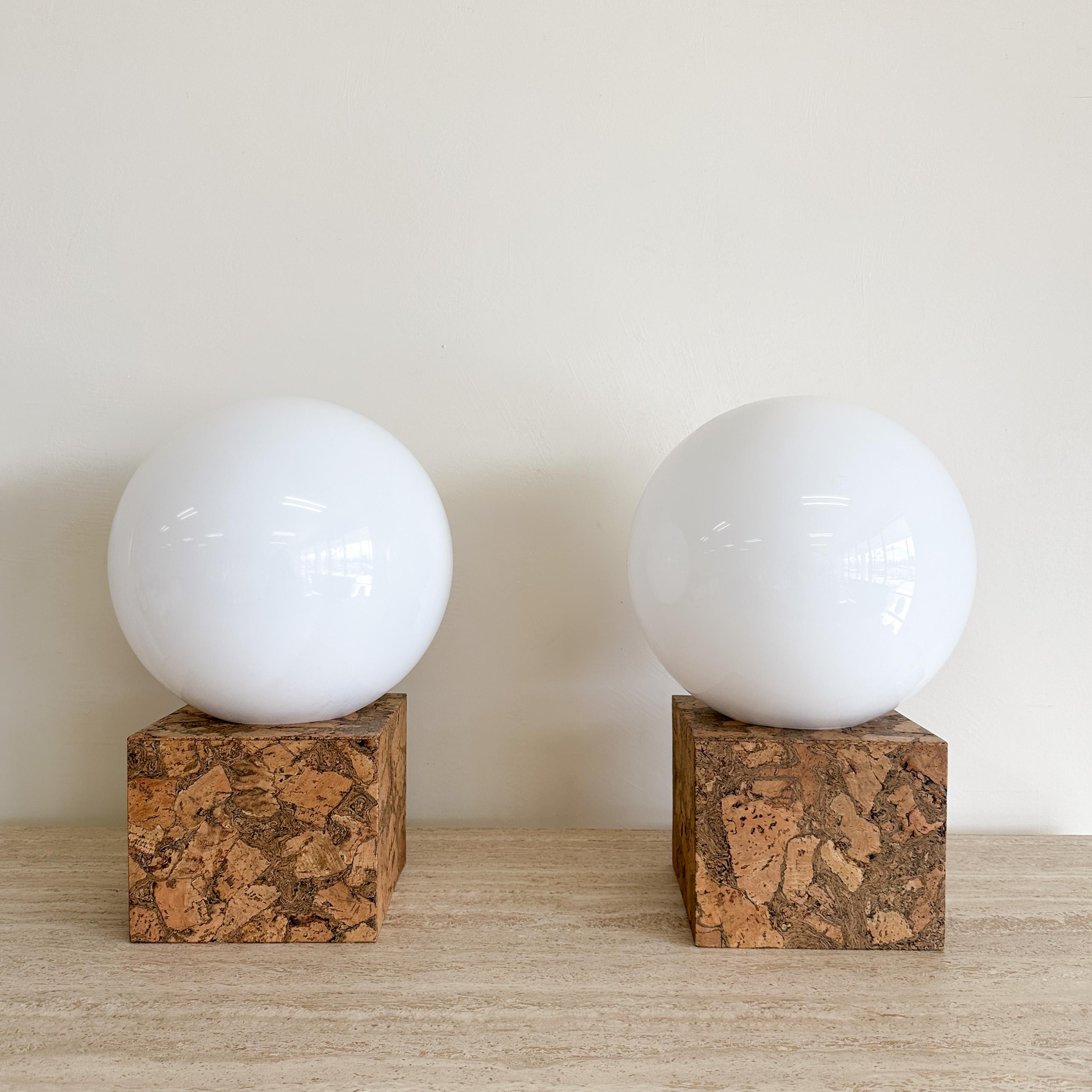 Pair of Cork & Acrylic Globe Lamps.

The lamps are newly made and are a limited addition to our new collection. They are made with porcelain sockets and twisted rayon-covered lamp wire. The switch is on the cord for easy access. The lampshade is