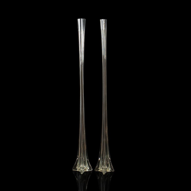 This is a pair of vintage Iris vases. A French, 4' tall glass gladioli or flower vase, dating to the late 20th century, circa 1970.

Elegantly shaped and impressive in height
Displaying a desirable aged patina
Blown glass in good order