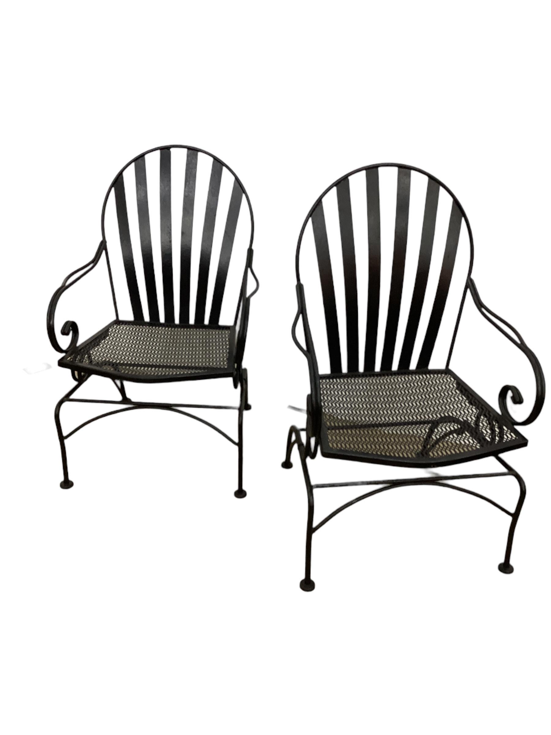 Pair of Vintage Iron Cantilevered Chairs with mesh seats and slat backs. Please contact us for competitive shipping quotes.