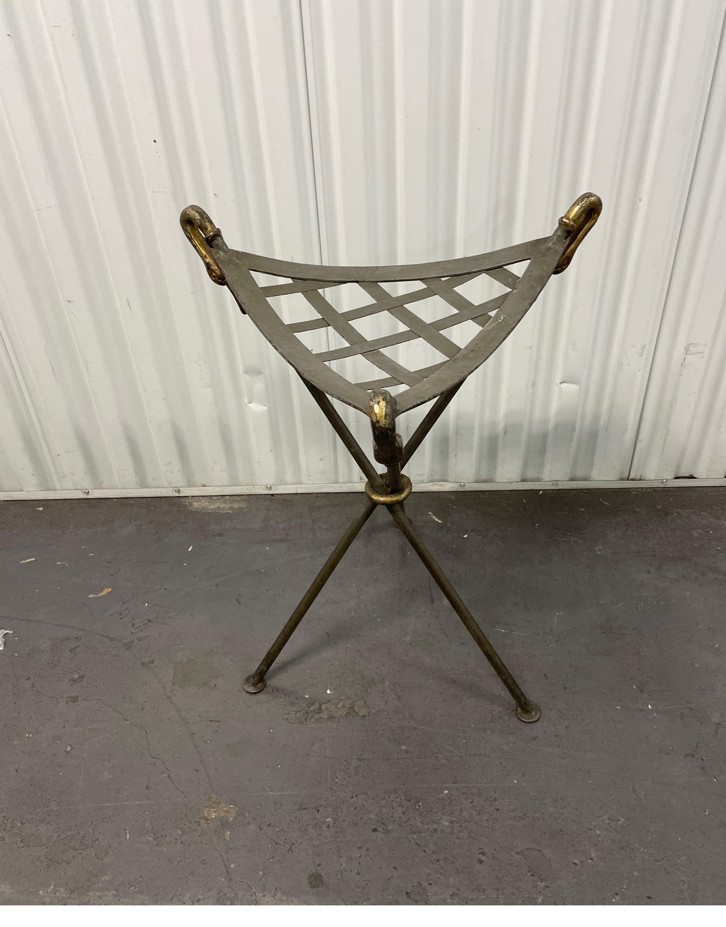 Vintage pair of tripod iron stools with lattice seats and gilded swan heads.