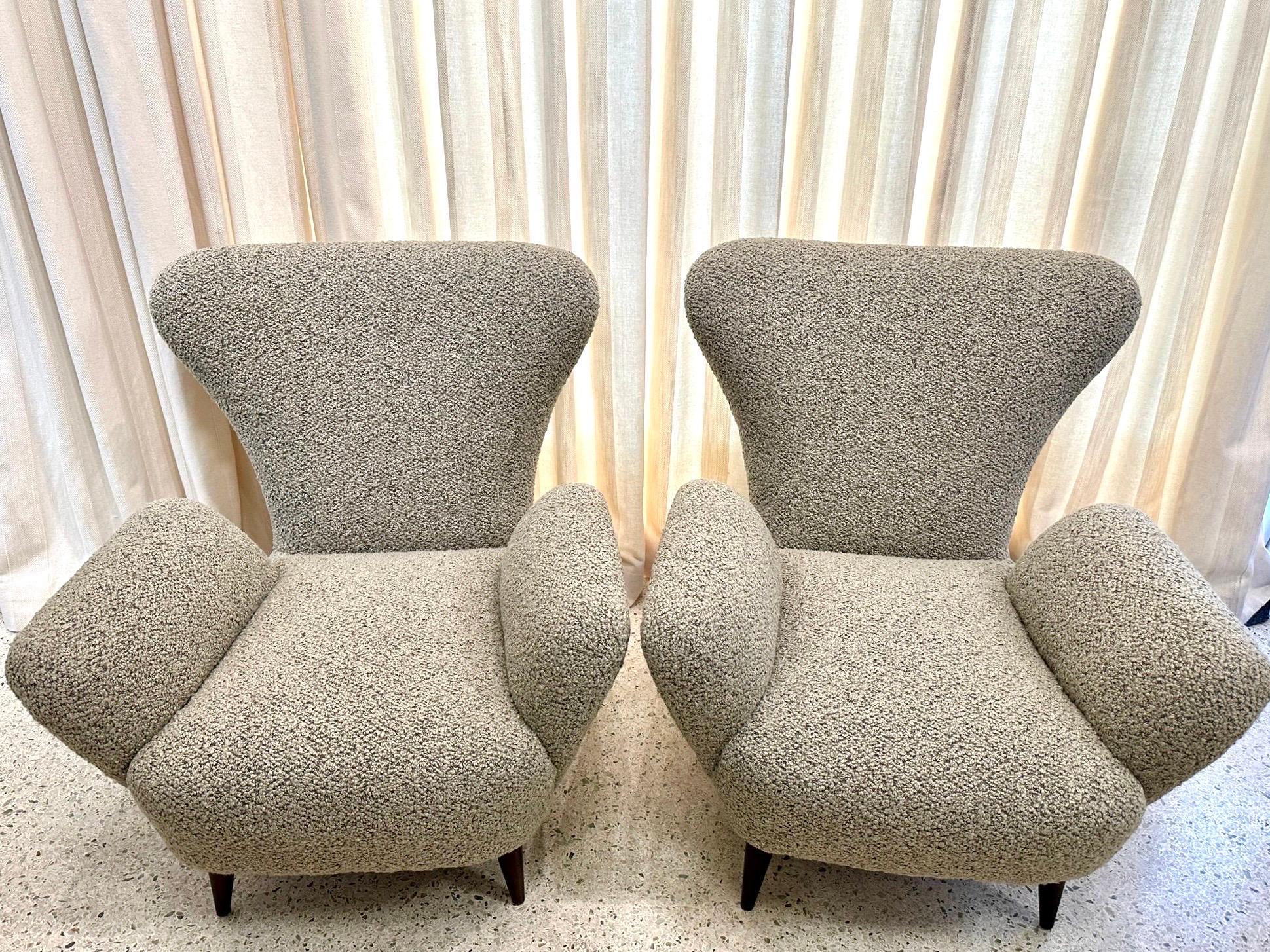 Emilio Sala and Giorgio Madini, armchairs with tapered wooden legs, Italy, 1940's - these low armchairs with wonderful soft curves and armrests.  Fully and expertly restored, reupholstered with new Bouclè.