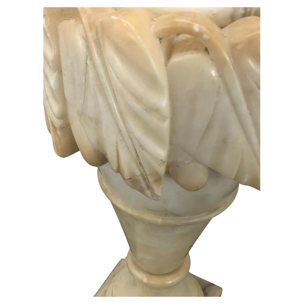 Pair of Vintage Italian Alabaster Urn Lamps with boldly carved leaf design. Newly  wired with 3-way sockets.