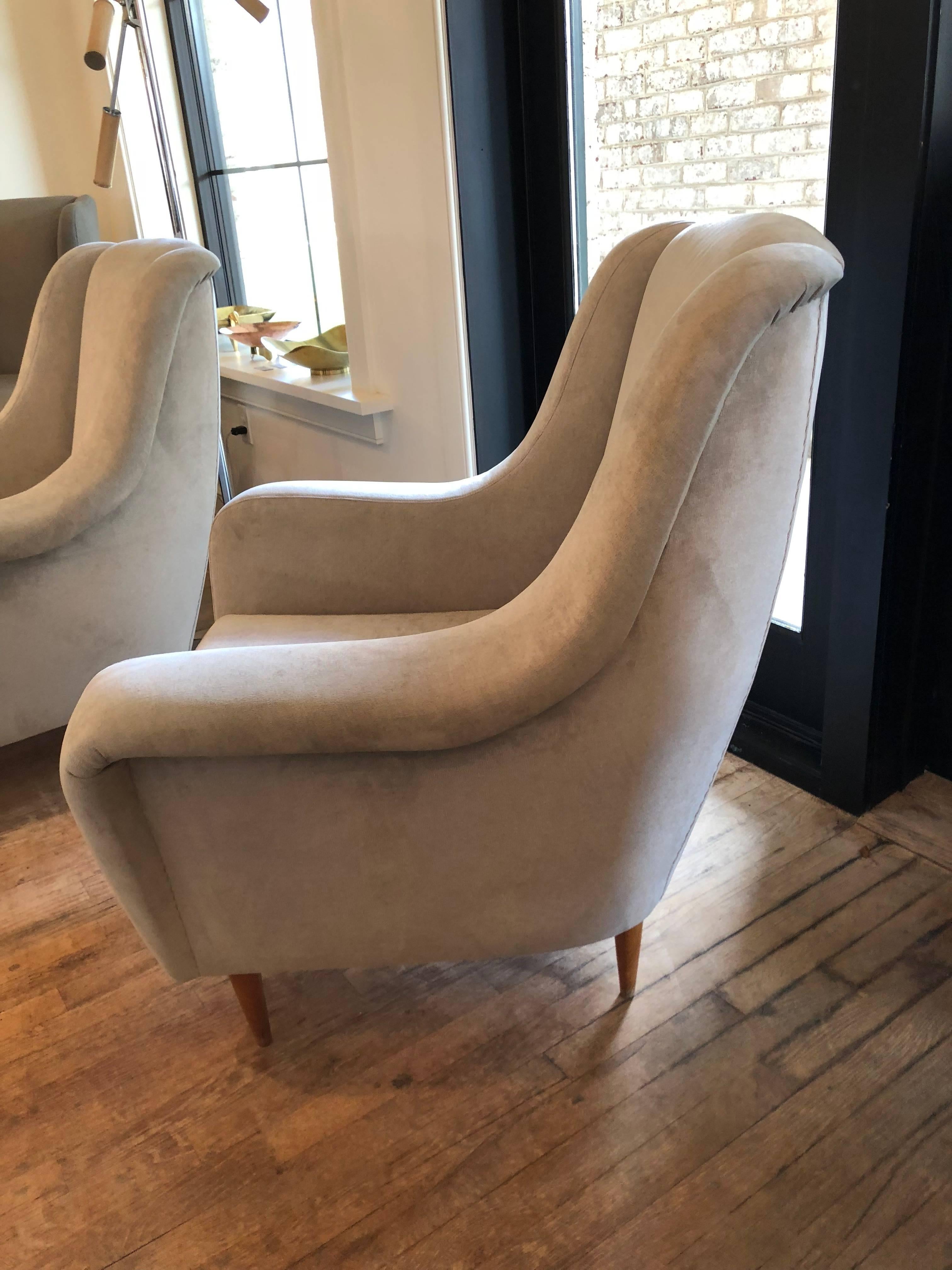 This vintage pair of Italian armchairs are in the style of Gio Ponti, newly recovered in grey linen velvet with fine upholstery details. Sold as a pair.