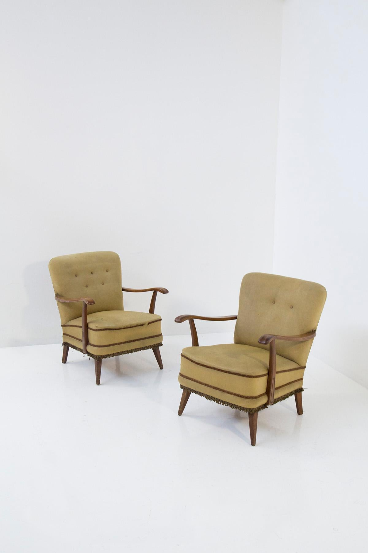Enter a realm where time has stood still, where the essence of mid-century Italian design comes to life in the form of an elegant pair of armchairs. These are no ordinary chairs; they are a testament to the creative genius of Paolo Buffa, a master