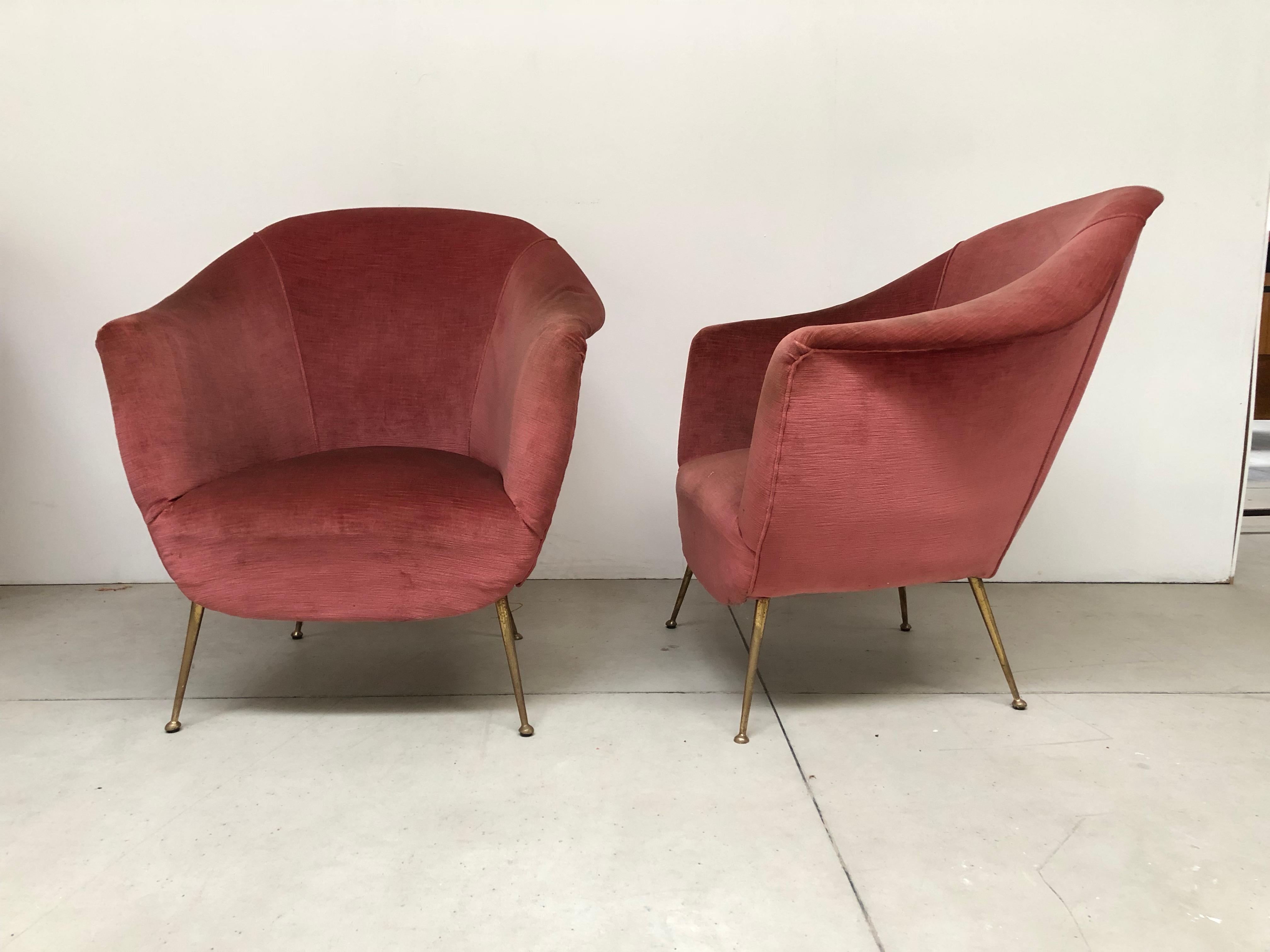 This set of two vintage Italian armchairs features in a delicious pink velvet and brass feet.