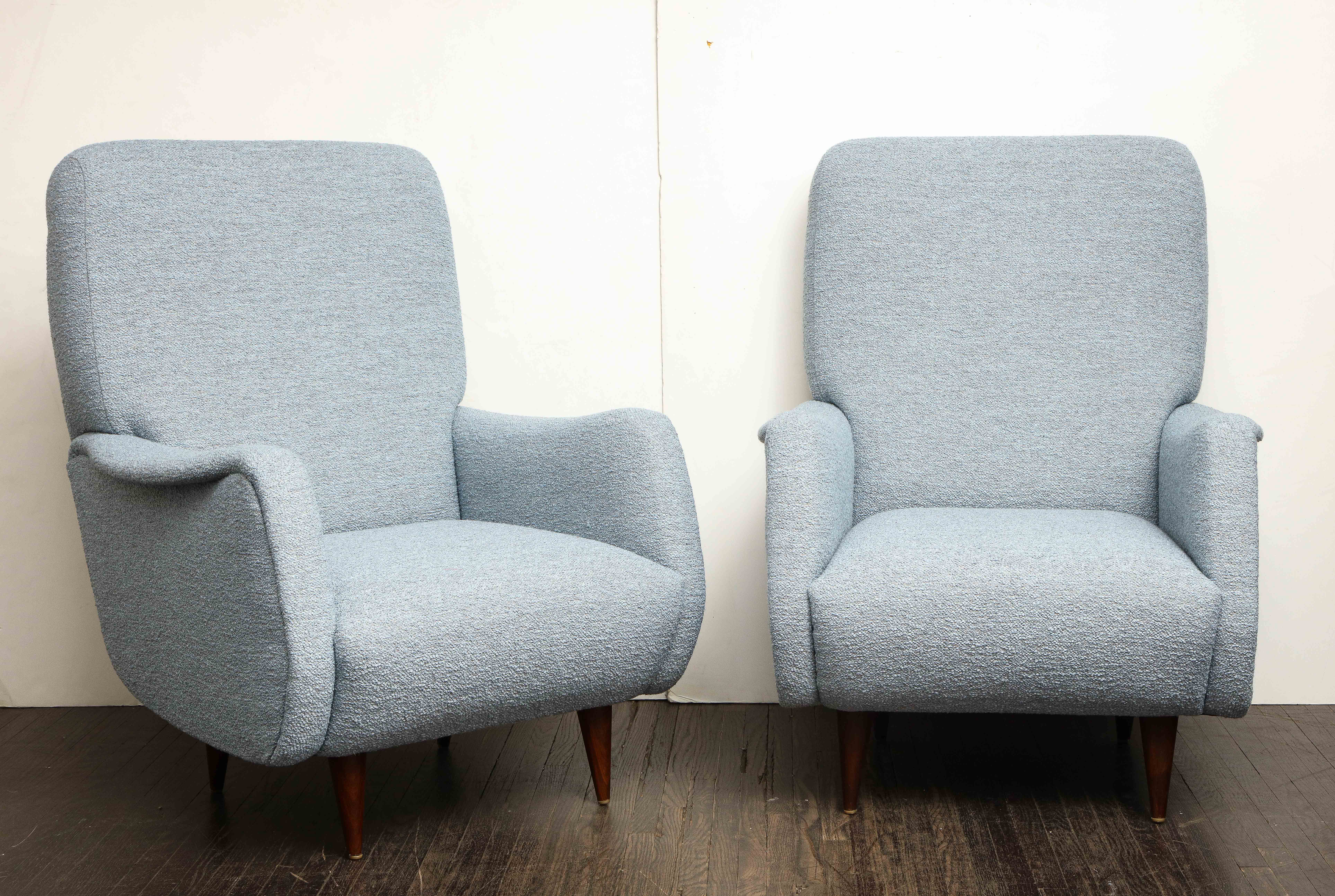 Pair of vintage Italian armchairs in light blue boucle fabric. It has a classic mid century style profile with tapered wooden legs. Reupholstered in 2021.
