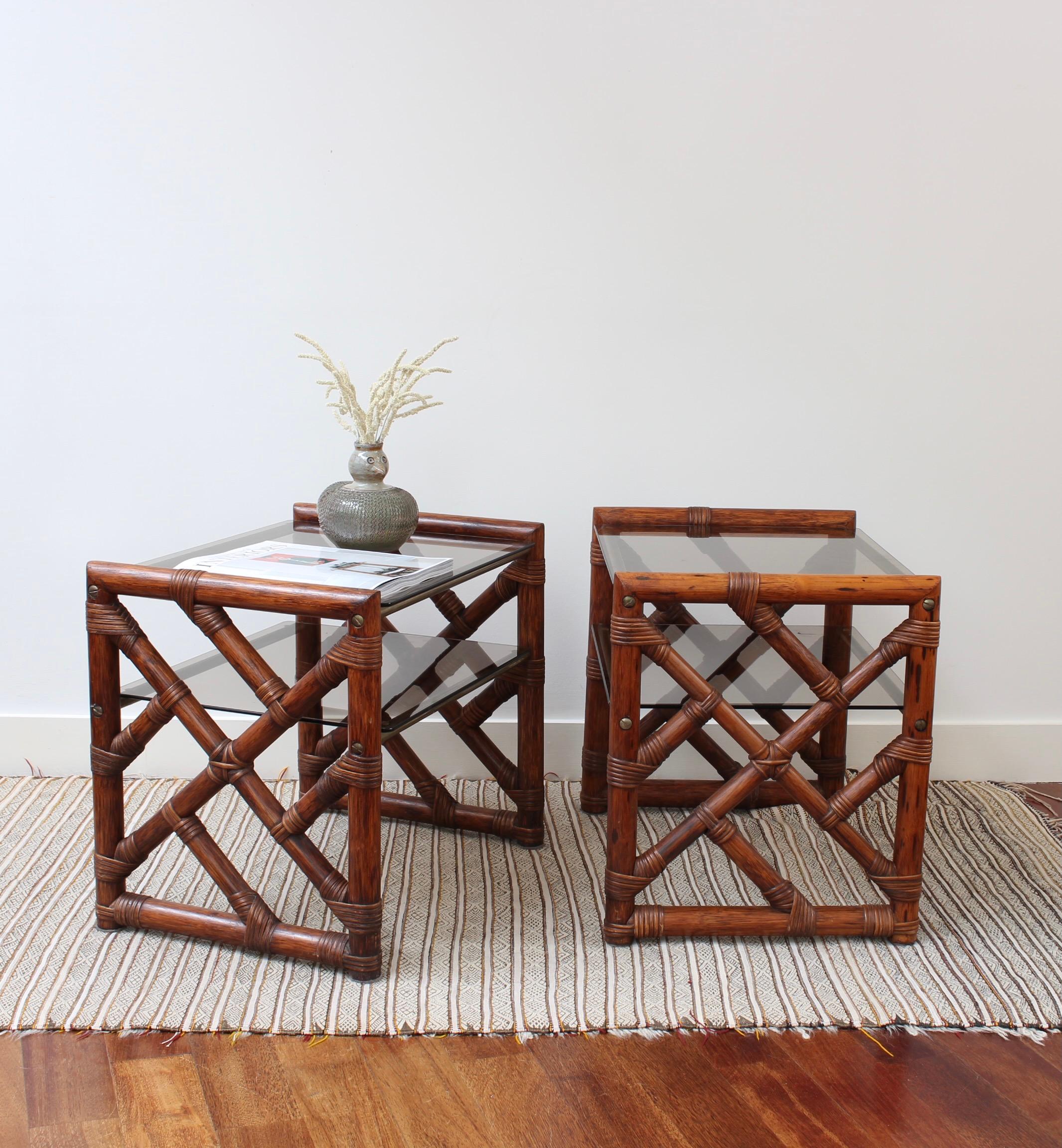 A pair of vintage Italian side tables (circa 1970s) that were discovered in Florence, Italy. Stunning design from top to bottom, the frames consist of rectangular bamboo ends stained in a delicious reddish-brown with geometrically positioned struts