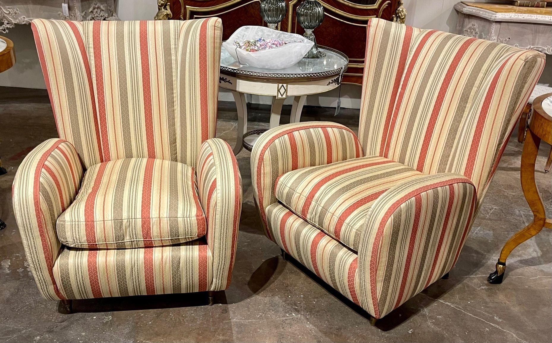 Handsome pair of vintage Italian Bergeres. Upholstered in a striped fabric with creme, rust and green. Very nice! Comfortable too.