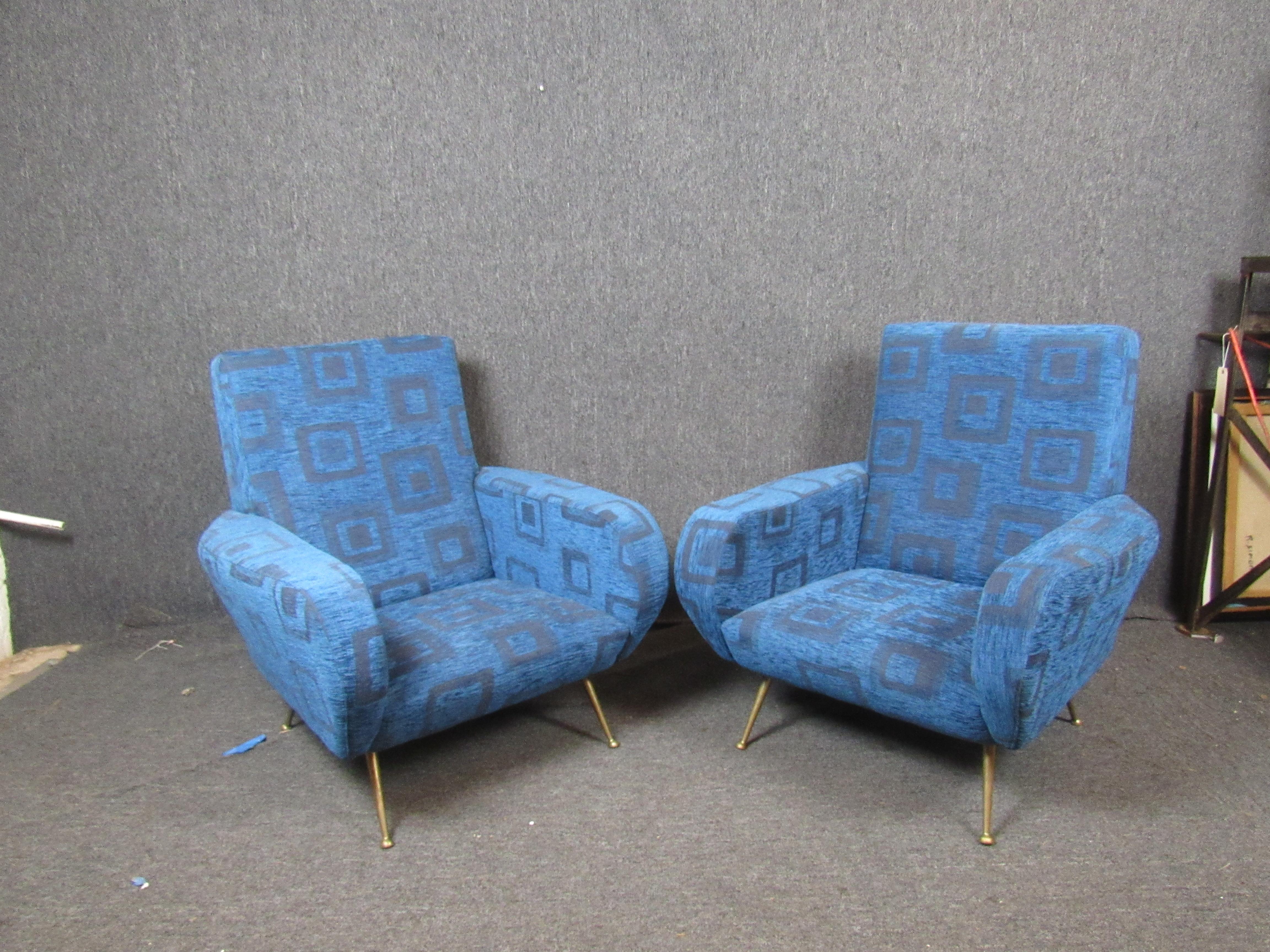 Absolutely stunning pair of vintage Italian mod lounge chairs. Featuring the funky, geometric upholstery with genuine brass accents. A large, plush seat with ample back support is sure to make these chairs as comfortable as they are attractive.