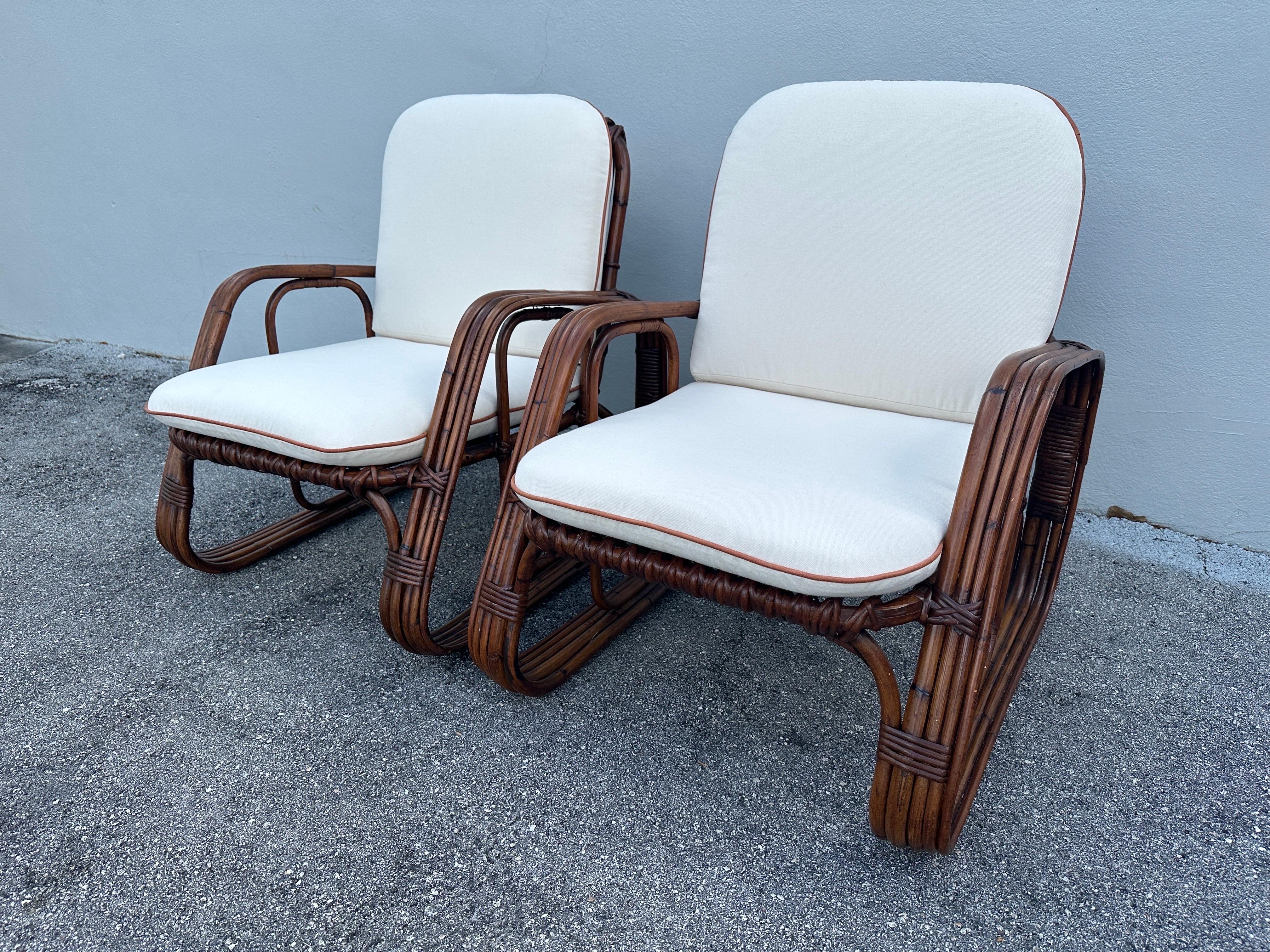Pair of bent bamboo Lounge Chairs by famous Italian Brand Bonacina that is known for its amazing craftsmanship of bamboo furniture. The condition on this pair is superb and the chairs are ready to use. NEW custom cushions have been made to