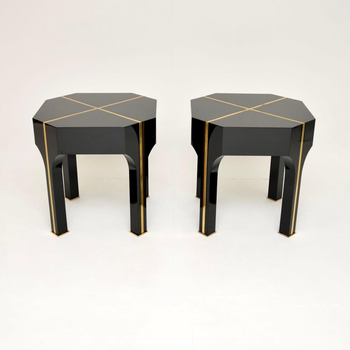 A fantastic pair of vintage Italian brass inlaid side tables, dating from around the 1970-80’s.

The quality is outstanding, they are large, impressive and extremely well made. They are made from black laminate with inlaid solid brass strips and
