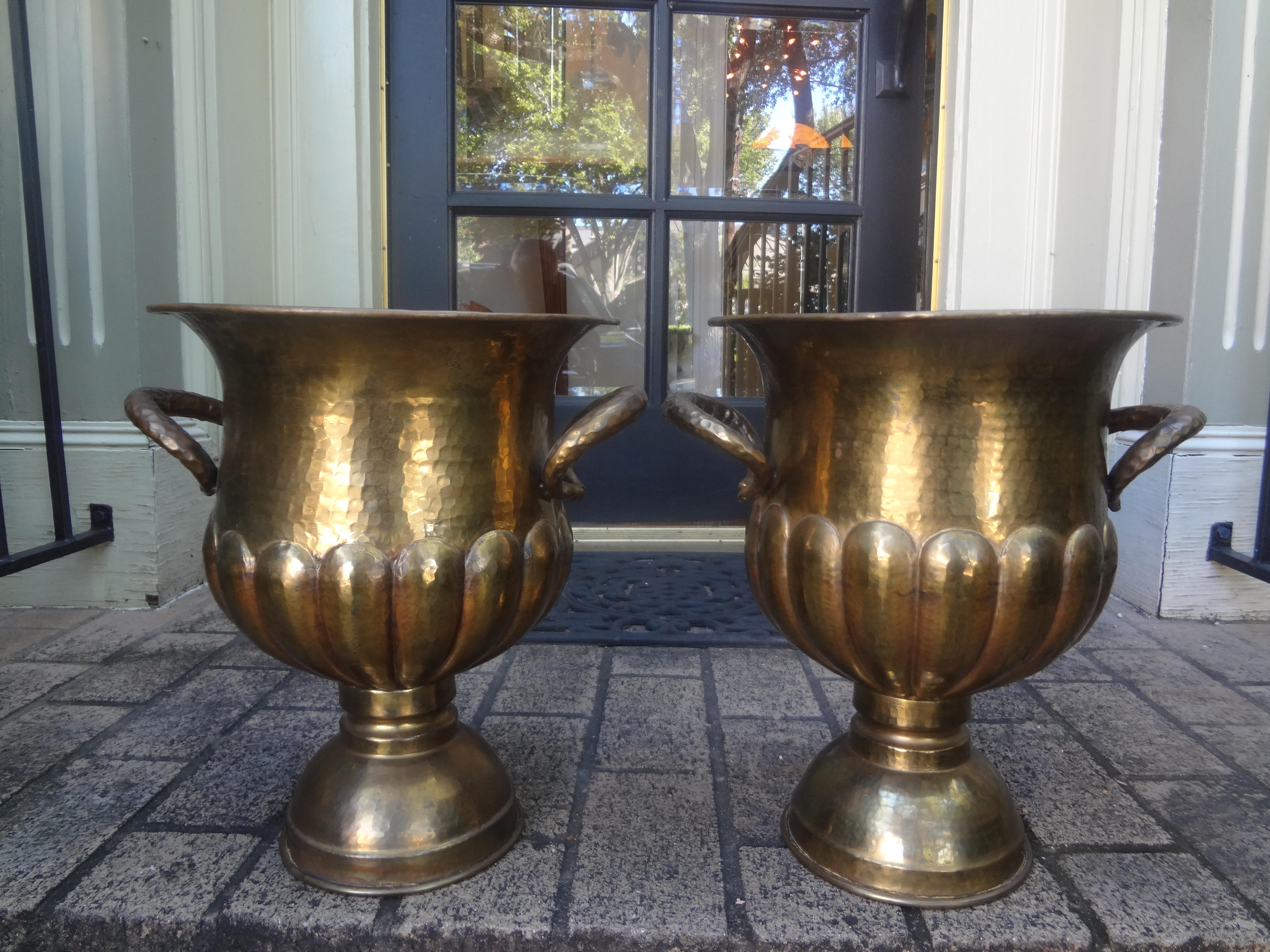 Pair Of Vintage Italian Brass Wine Or Champagne Coolers.
This pair of Italian brass wine or champagne coolers or urns with hammered brass handles. 
in the manner of Egidio Casagrande would work as planters or jardinieres. Stamped Italy.
Great patina!