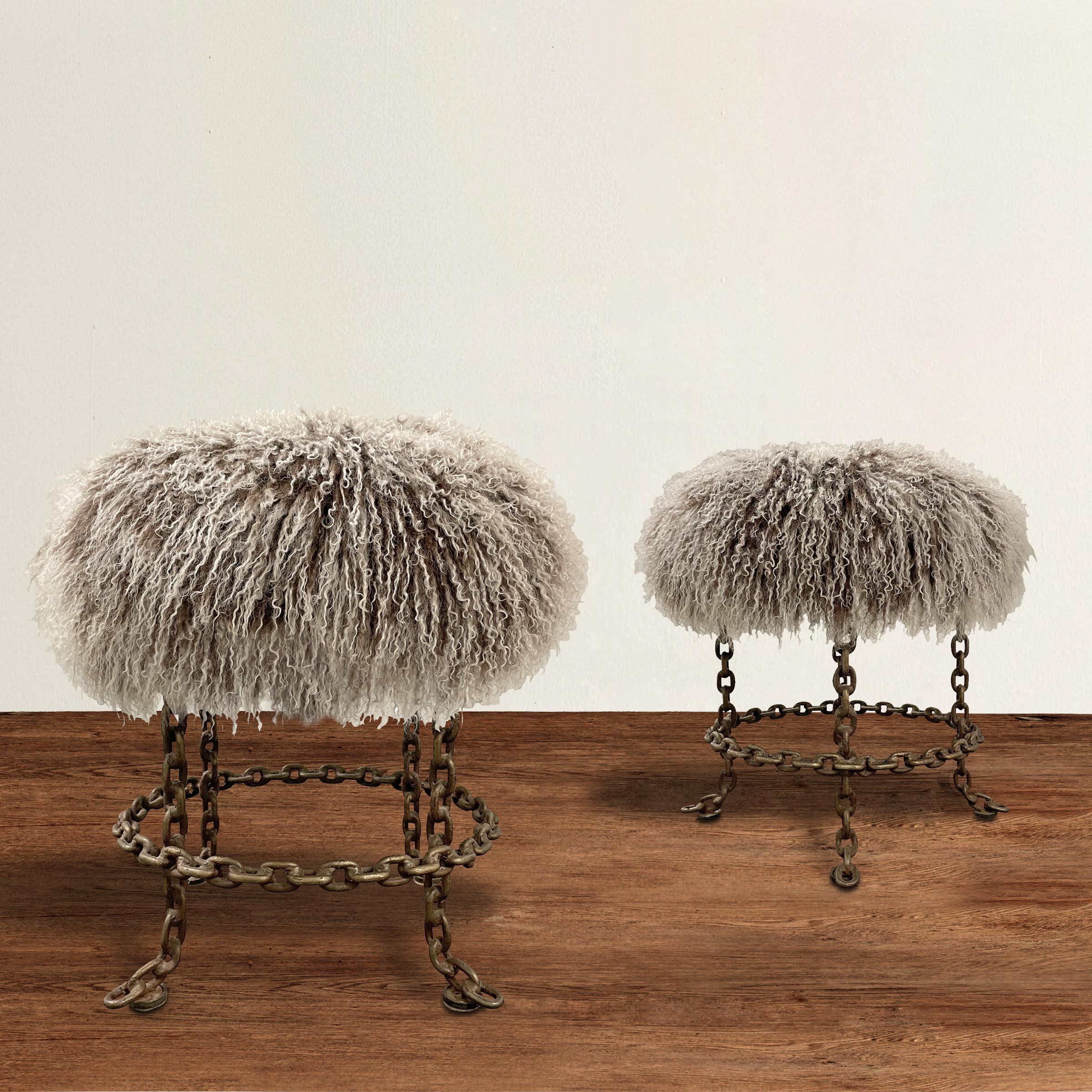 A fantastic pair of vintage Italian stools constructed from heavy chain and with newly upholstered curly Mongolian lamb fur (with frosted tips) seats that swivel. Perfect tucked under a console for additional seating in your living room, but also