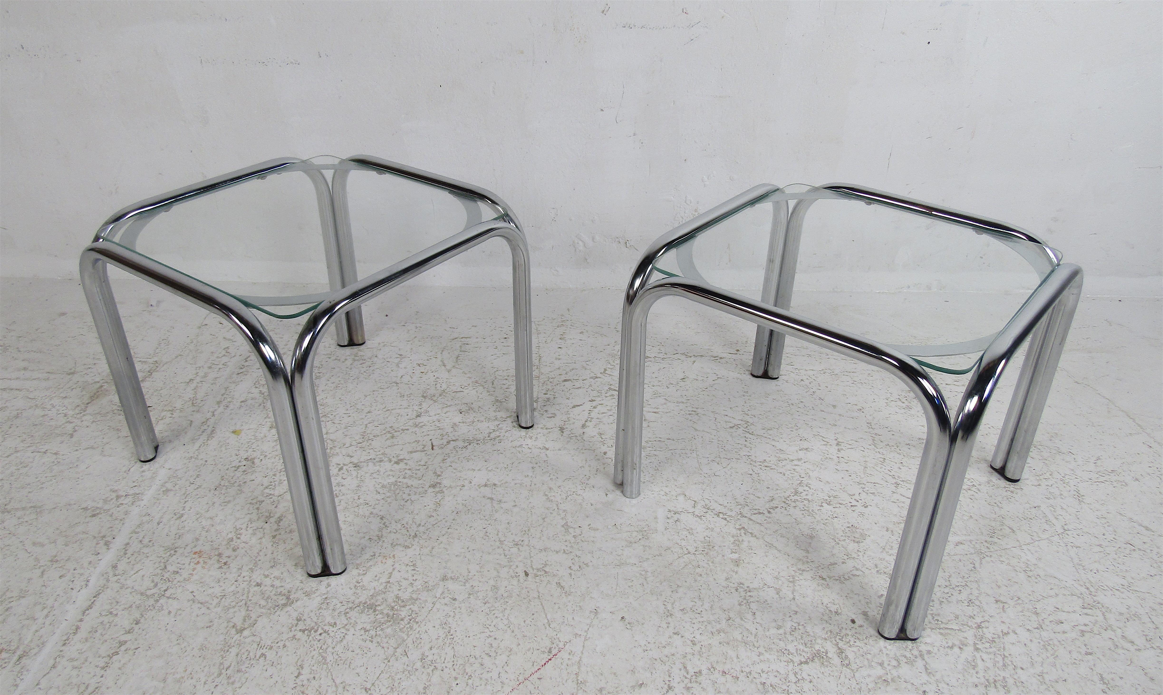The unique tubular chrome frame supports a glass top. A wild Italian modern design with a glass top that appears to be floating when seen from certain angles. A sharp-looking pair of tables that are sure to set the tone in any room. Sleek and