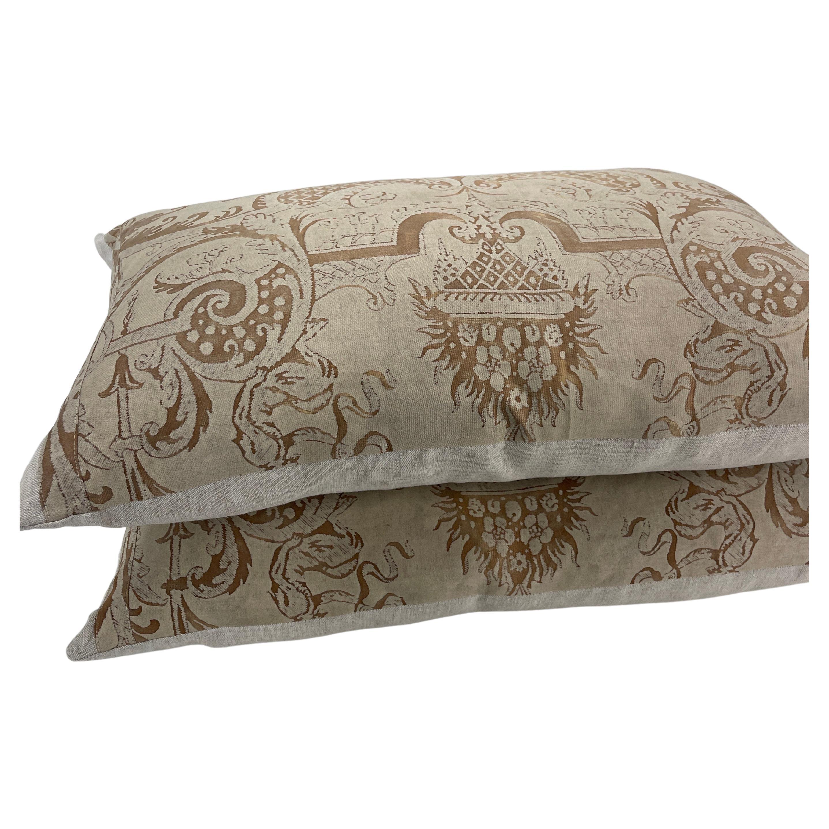 Fortuny Fabric pair of textile pillows in Royal Gold pattern, Italy

Collected and coveted Fortuny fabric on the front and flax linen on the back. Feather down inserts are included as well as hidden zipper enclosures. 
Fortuny Fabrics is