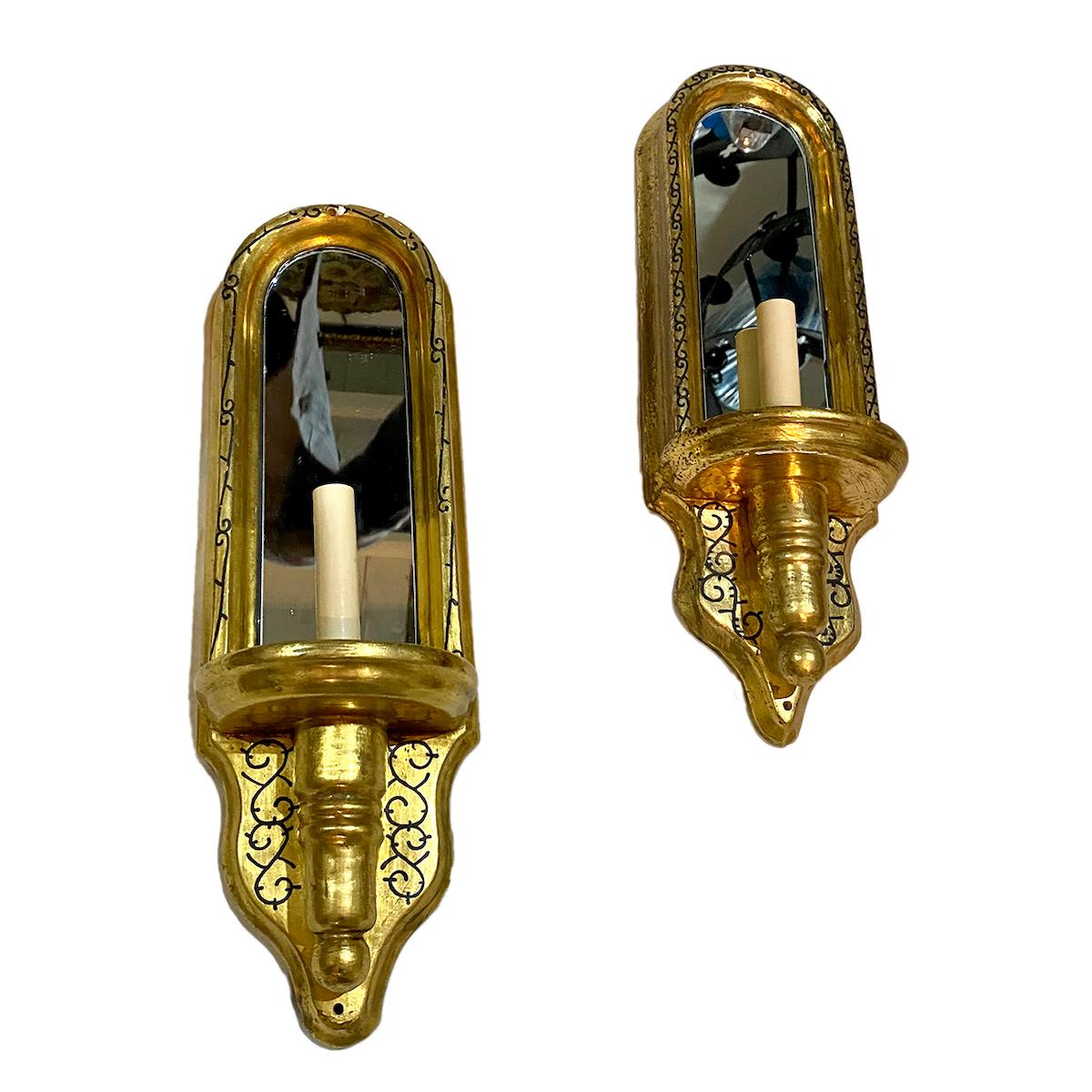Pair of 1960’s Italian gilt wood sconces with mirror backplate.

Measurements:
Height: 19?
Width: 6?
Depth: 5?.