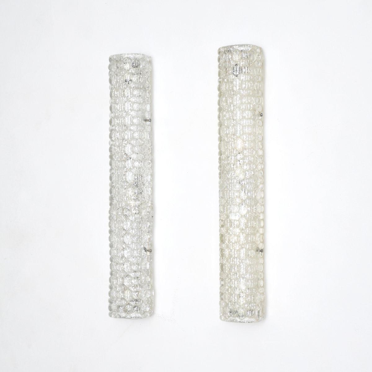 A stunning pair of vintage Italian glass wall sconce lamps, dating from the 1960-70’s.

They are a good size, quite large and very impressive. The curved, textured glass shades are beautifully made and are very thick. Each lamp has bolts that attach