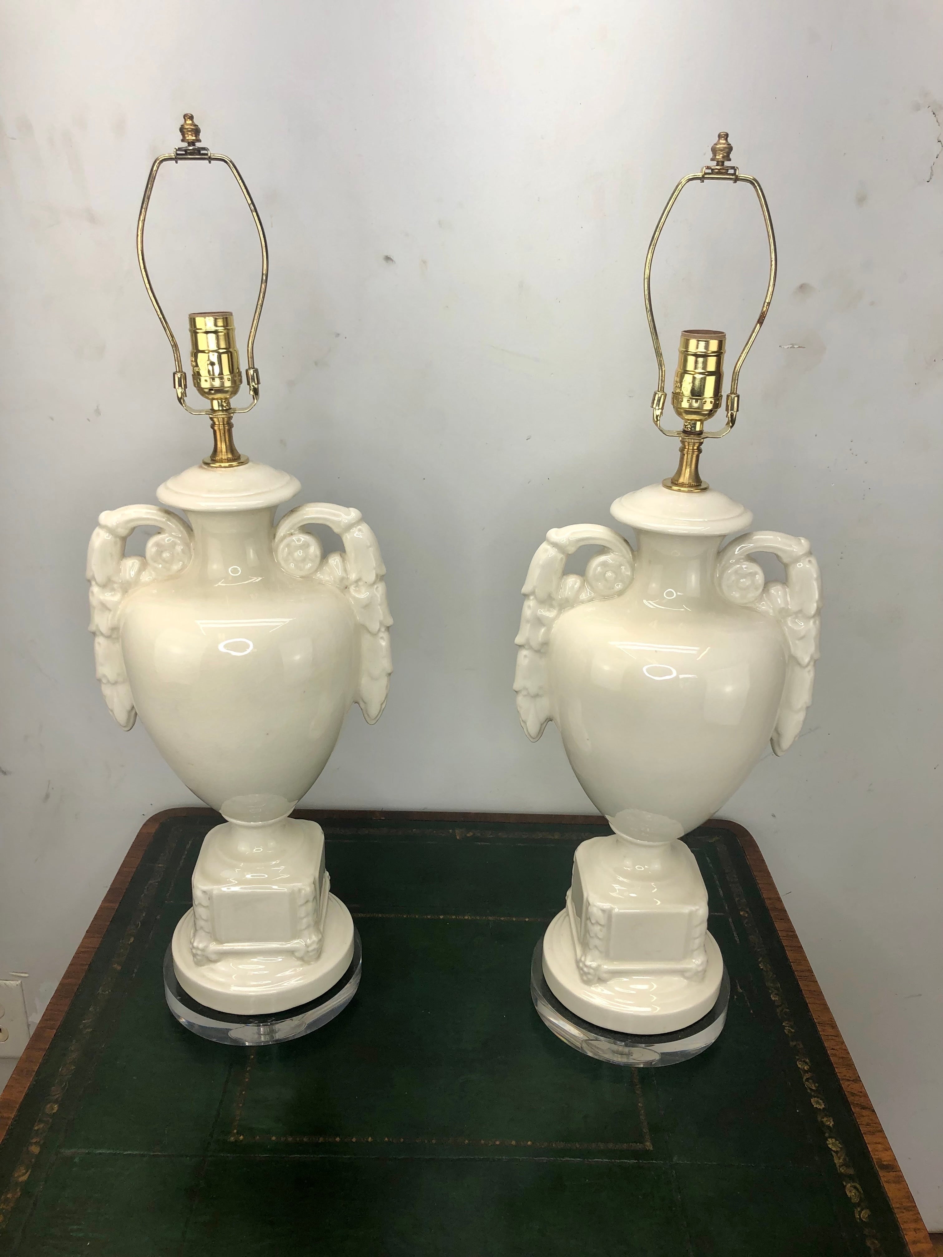 Pair of Vintage Italian Glazed Ceramic Urn Lamps. These white glazed ceramic lamps have new lucite bases and have been newly wired, new 3-way sockets.