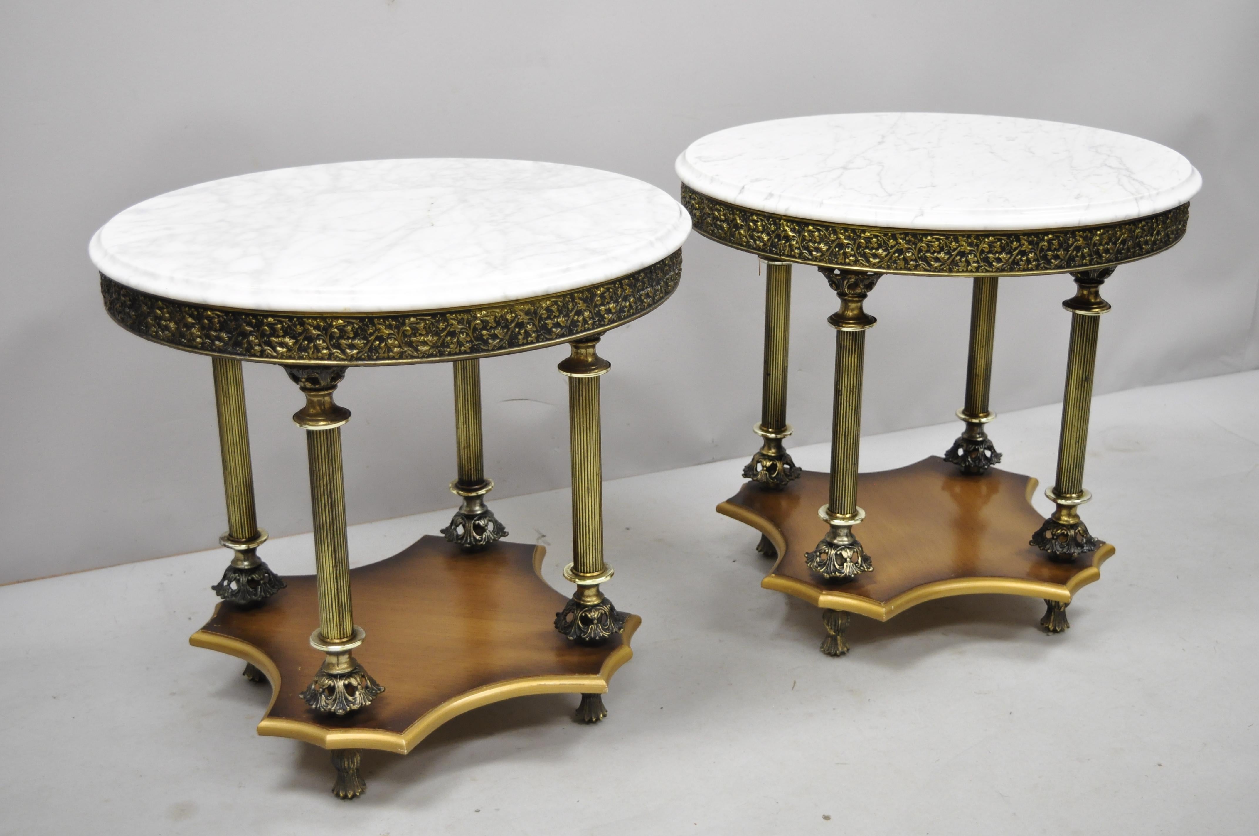 Pair of vintage Italian Hollywood Regency round marble-top side tables. Listing includes round white marble top, metal columns, wooden base, very nice vintage item, great style and form, circa mid-20th century. Measurements: 22.5