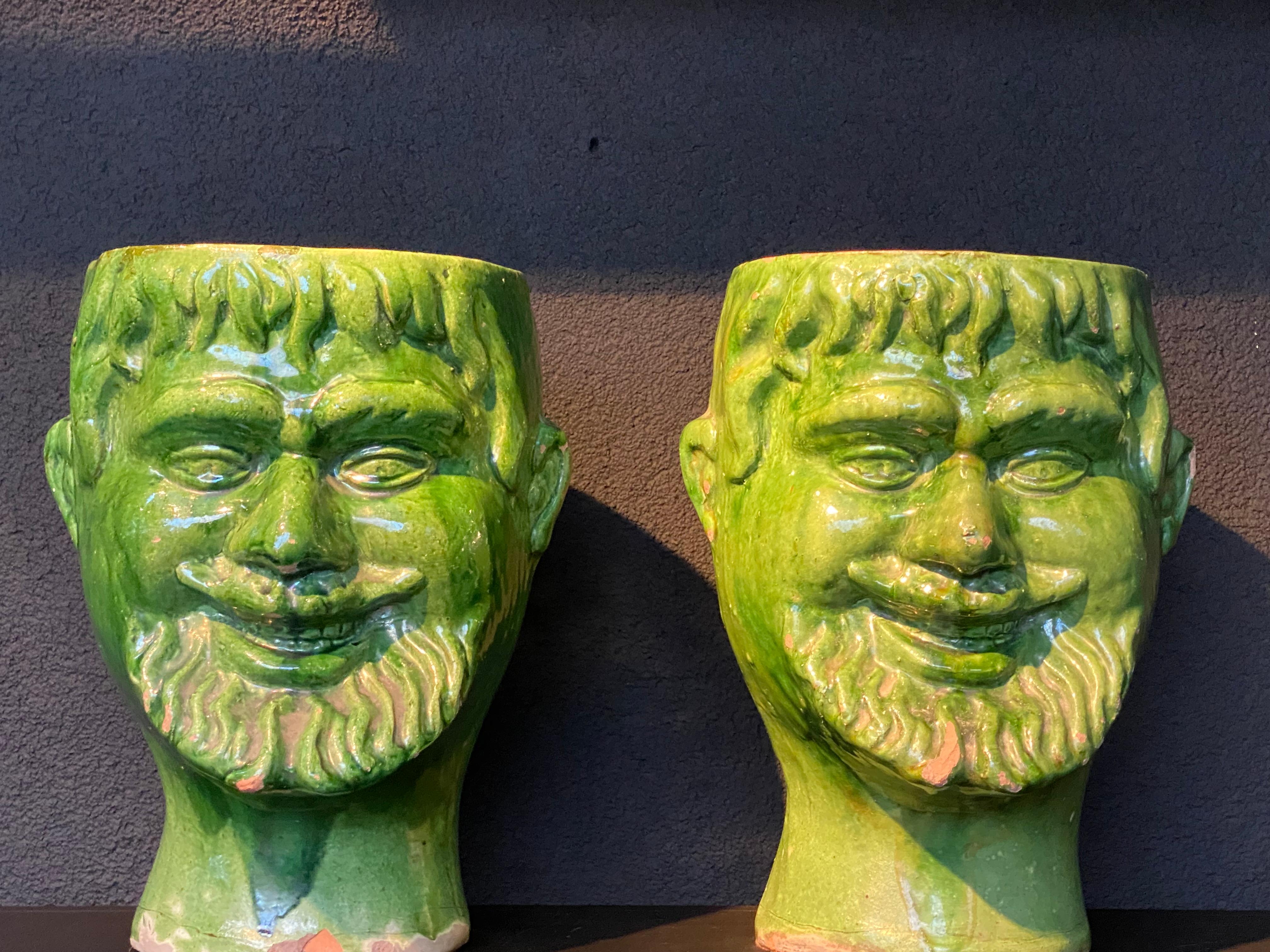 Beautiful pair of Vintage Italian Cache Pots,from the 1970 ies,
green glazed Terracotta, human face of a Man,
good shine and patina of the Terracotta,
very decorative objects