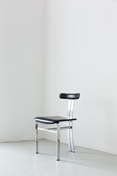 Sculptural dining chairs in black leather and chromed metal, Italian Space Age