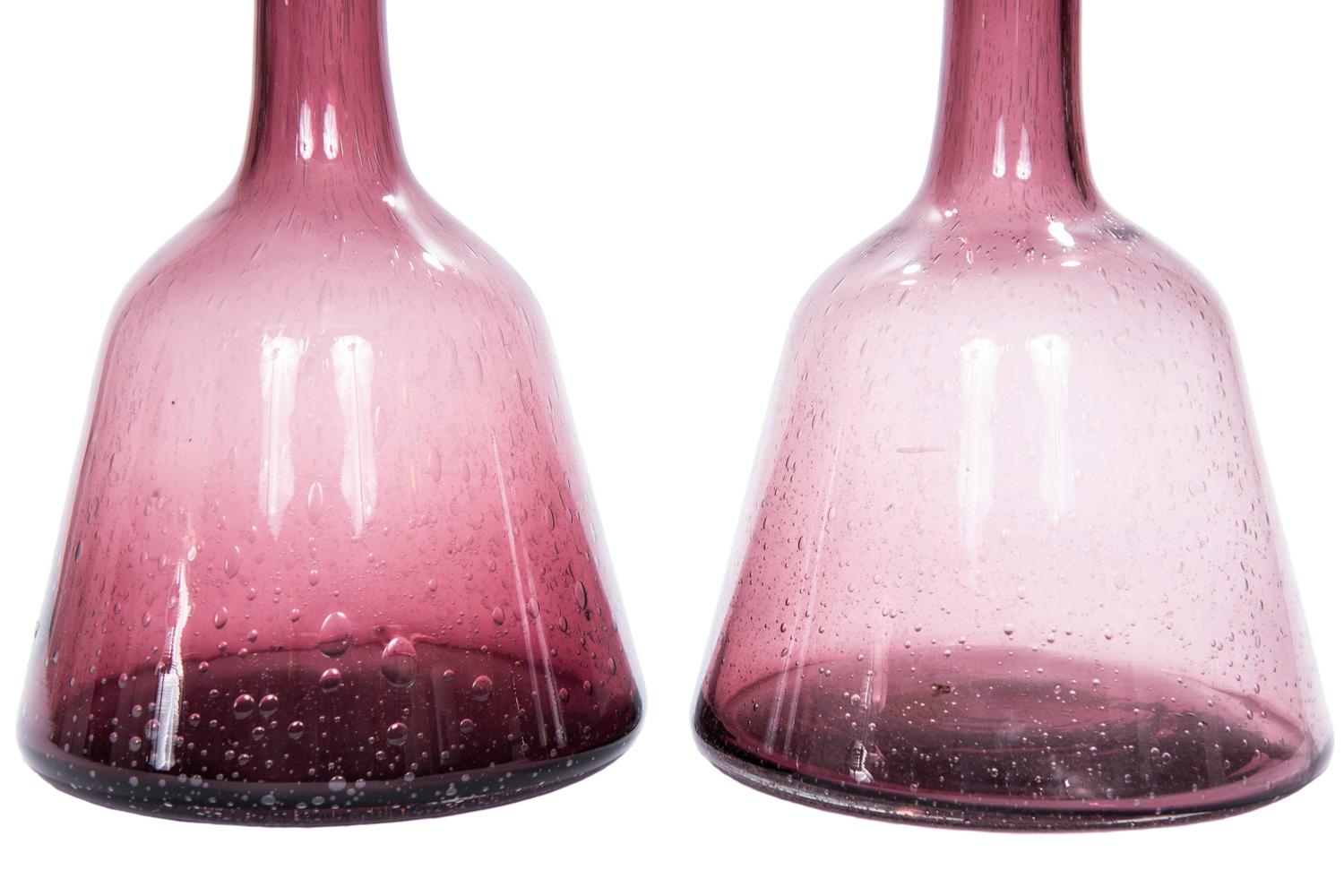 It is always awesome to have a pair of decorative decanters! They are weighty with random bubble inclusions encased in rich amethyst colored glass. These beauties are Italian and I suspect are Murano. 

 