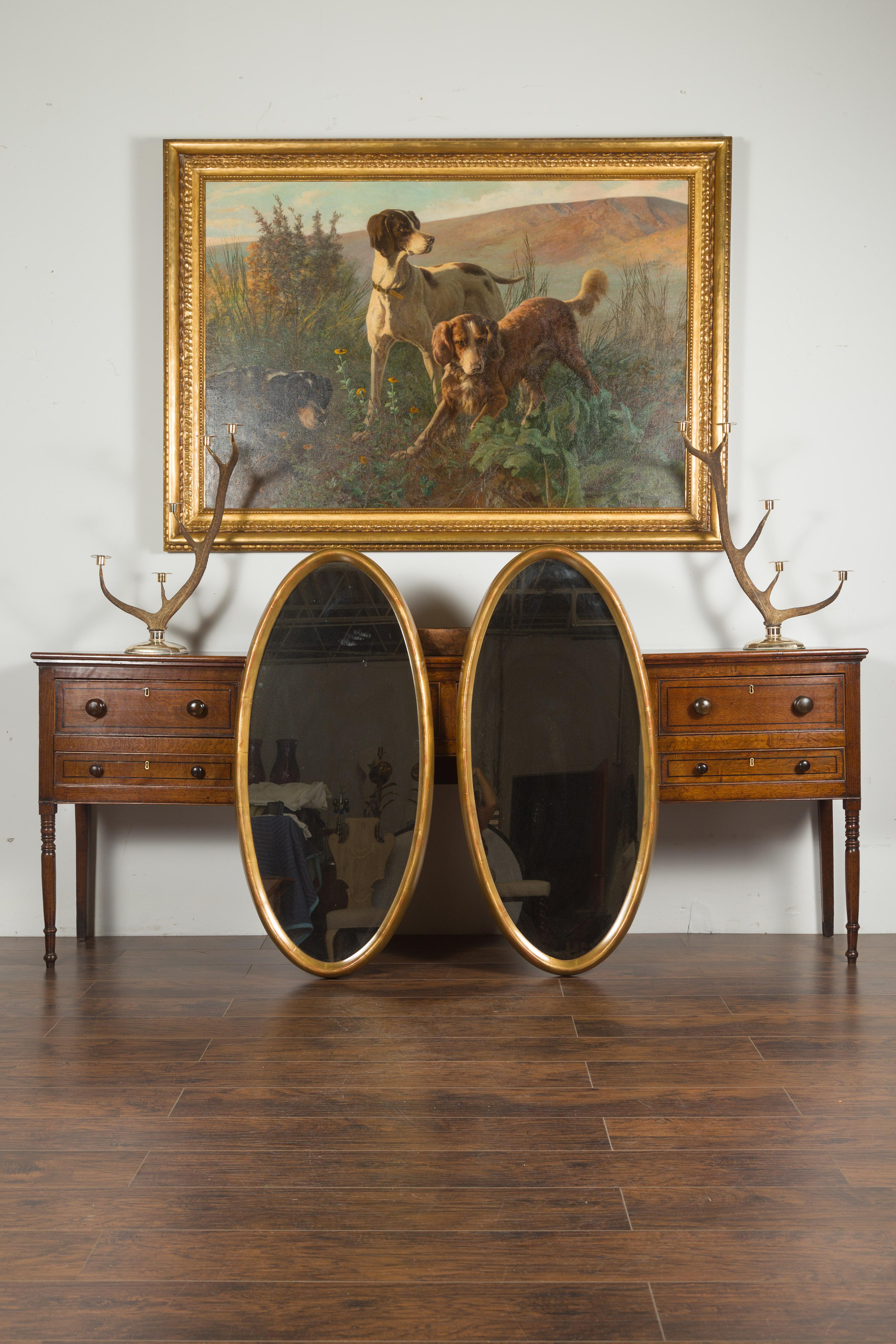 Paire de grands miroirs ovales italiens du milieu du siècle dernier en bois doré aux lignes épurées Bon état - En vente à Atlanta, GA