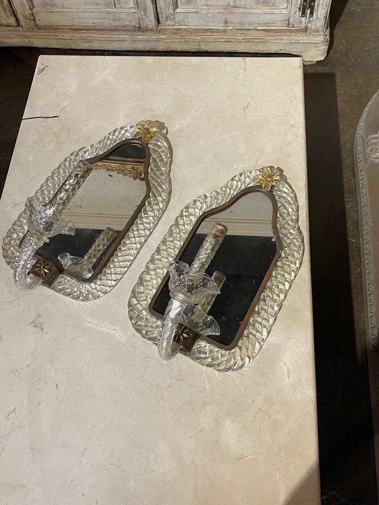 Decorative pair of vintage Italian Murano glass wall sconces with mirrored backs. Featuring beautiful textured glass. So pretty!!