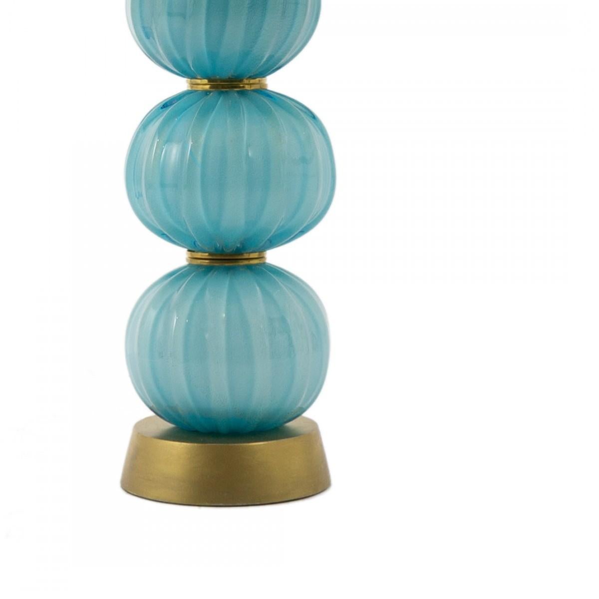 Pair of vintage stacked turquoise textured sphere table lamps, Italy, circa 1960. Opaque glass features gold fleck accents and with gold and brass detail.

Originally purchased from John Salibello. 

Includes custom shades as shown.