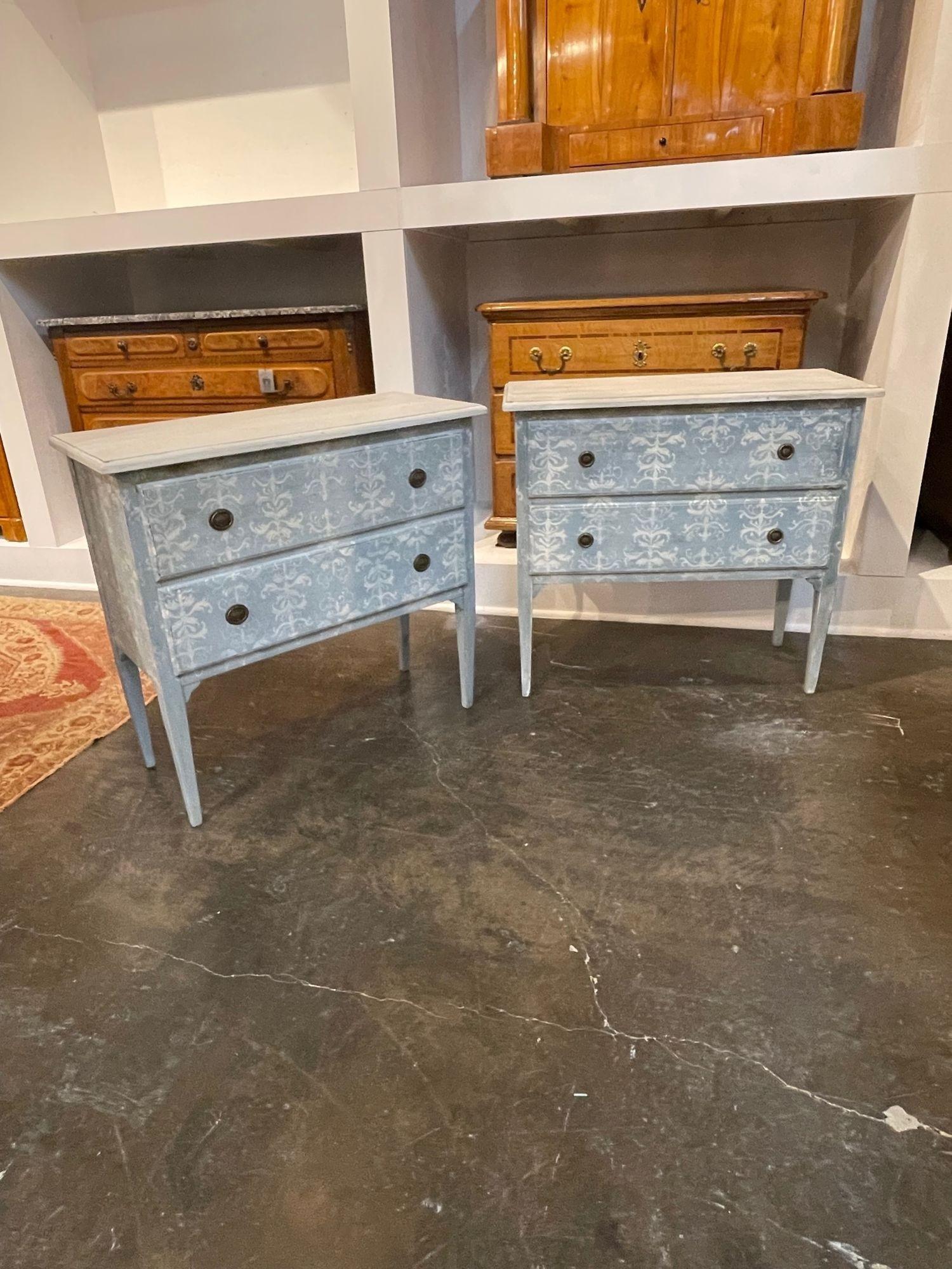 Lovely pair of vintage Italian neo-classical hand painted chests. Featuring a beautiful pale blue patina and a pretty floral like design. Creates a light and airy look. So pretty!!