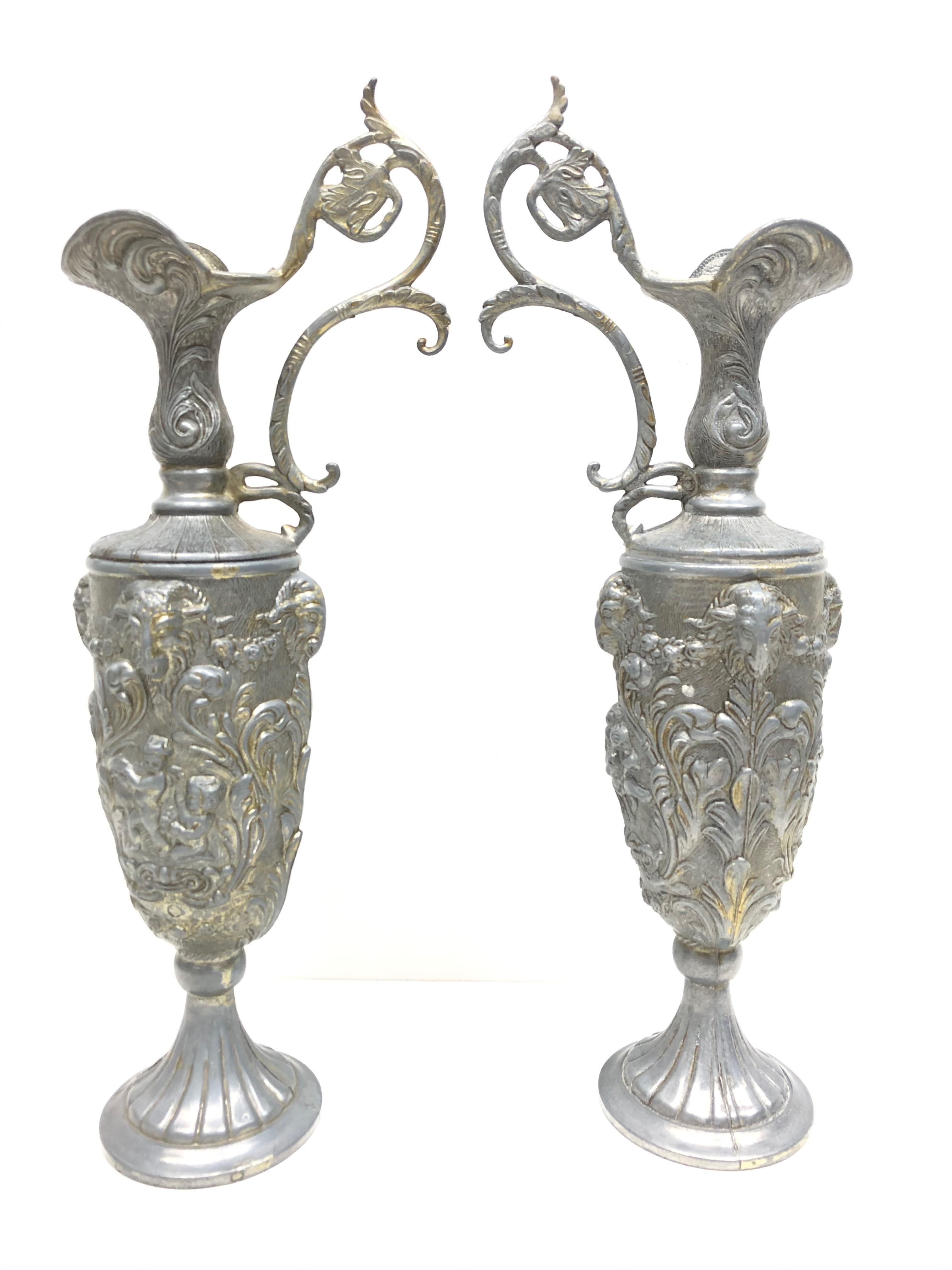 A pair of large amazing pewter vases, Ewer, or Amphoras made in Italy. Vases are in very good condition with a nice patina. Marked on the bottom 90% peltrato.