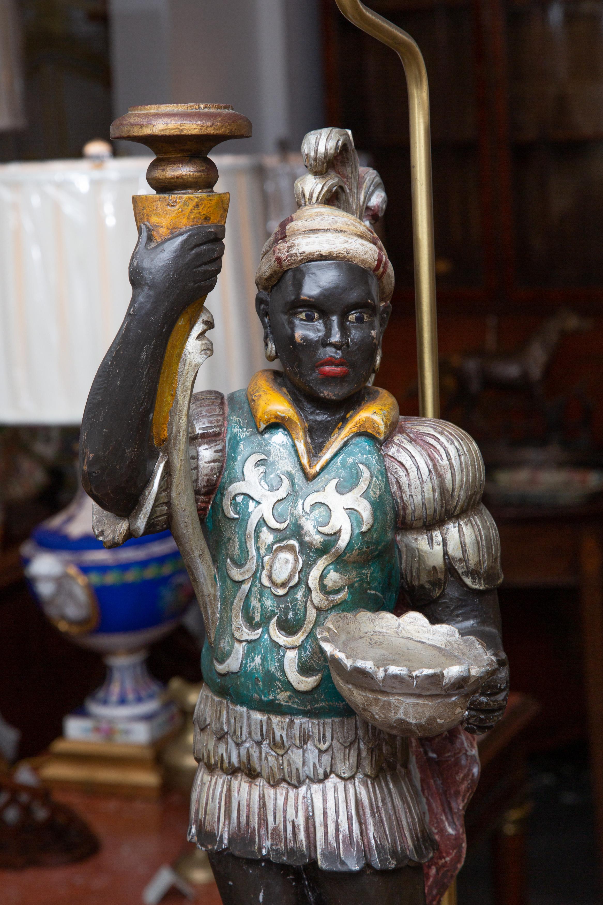 This is a charming pair of vintage Italian hand-carved, ebonized and polychromed exotic figures in lamp form.