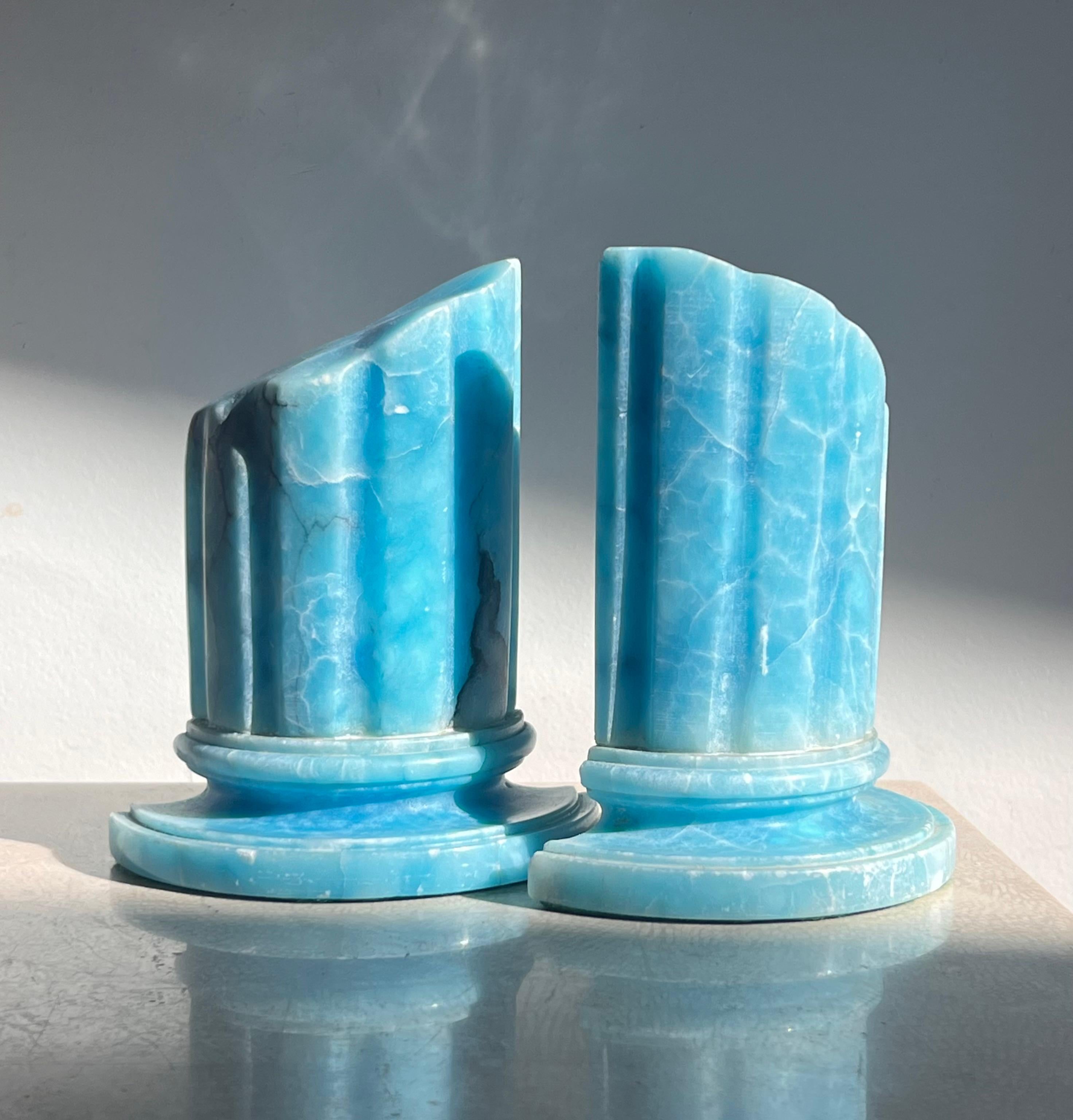 A stunning and rare pair of vintage Italian marble “ruins” bookends in swimming pool blue, 1960s. Hand-carved in the shapes of neoclassical ruinous columns. Pick up in LA or we ship worldwide. 
4.5” D x 4.75” W x 5.75” H